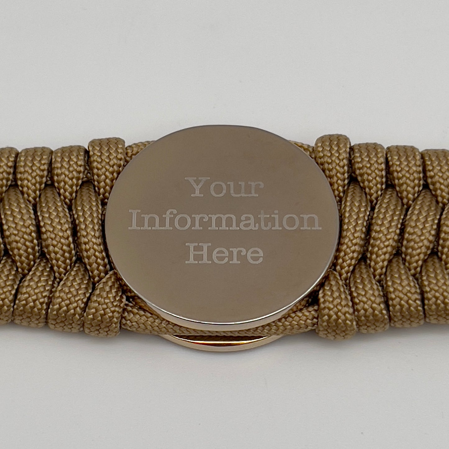 Thick and comfortable braided United States Marine Corps bracelet featuring a 24K gold and silver plated USMC officer Eagle Globe and Anchor medallion, a Cobra style tactical buckle and woven with gold 550 paracord.