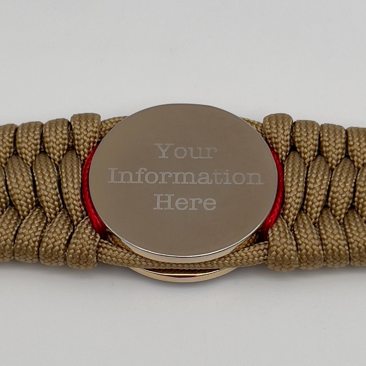 Thick and comfortable braided United States Marine Corps bracelet featuring a 24K gold and silver plated USMC officer Eagle Globe and Anchor medallion, a gold Cobra style tactical buckle and woven with gold 550 paracord and Imperial Red and Navy Blue micro cord.