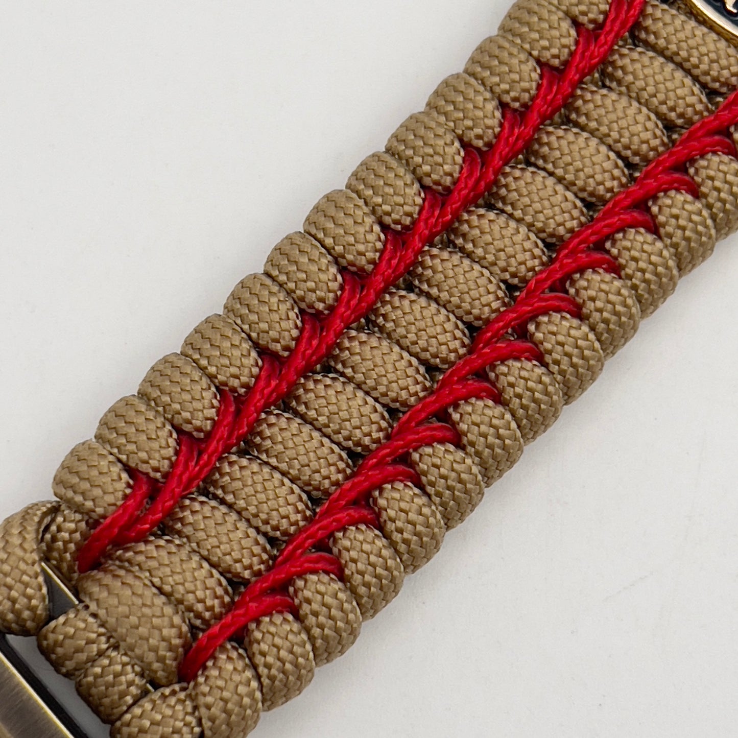 Thick and comfortable braided United States Marine Corps bracelet featuring a 24K gold and silver plated USMC officer Eagle Globe and Anchor medallion, a gold Cobra style tactical buckle and woven with gold 550 paracord and Imperial Red micro cord.