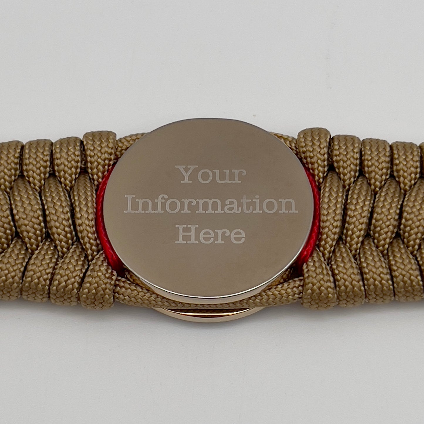 Thick and comfortable braided United States Marine Corps bracelet featuring a 24K gold and silver plated USMC officer Eagle Globe and Anchor medallion, a gold Cobra style tactical buckle and woven with gold 550 paracord and Imperial Red micro cord.