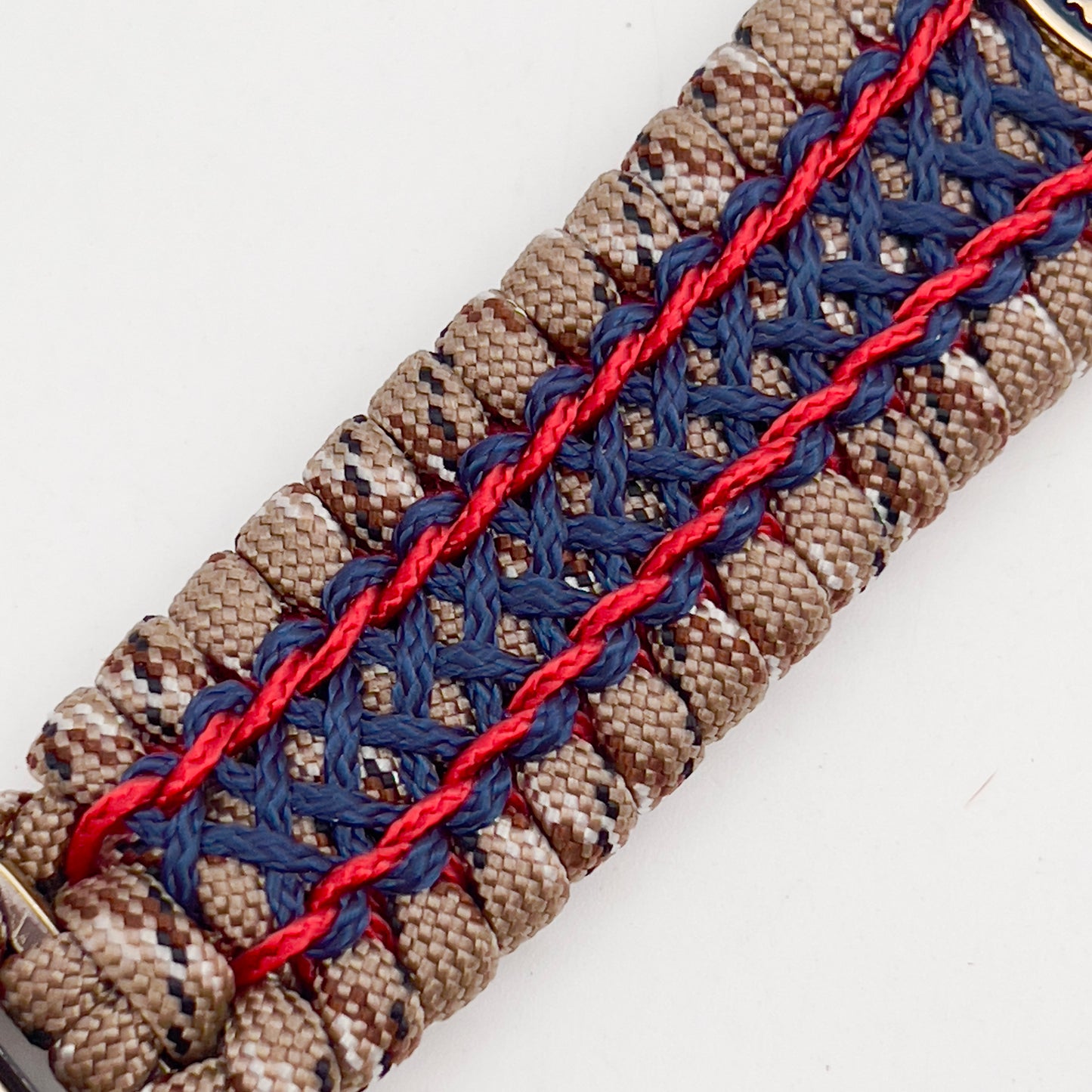 Thick and comfortable braided United States Marine Corps bracelet featuring a 24K gold and silver plated USMC officer Eagle Globe and Anchor medallion, a gold Cobra style tactical buckle and woven with Desert Camo 550 paracord and Imperial Red and Navy Blue micro cord.
