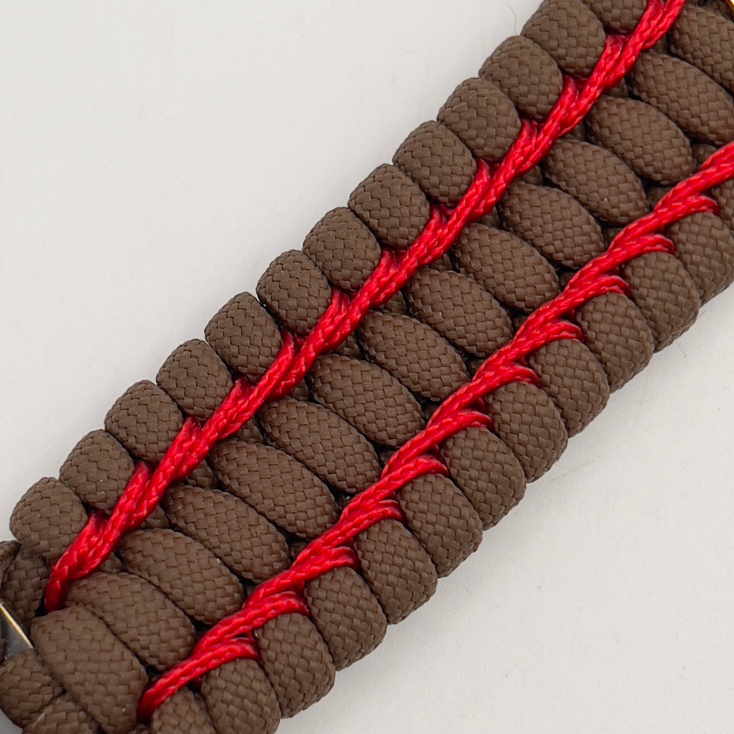 Thick and comfortable braided United States Marine Corps bracelet featuring a 24K gold and silver plated USMC officer Eagle Globe and Anchor medallion, a Cobra style tactical buckle and woven with Coyote Brown 550 paracord and Imperial Red micro cord.