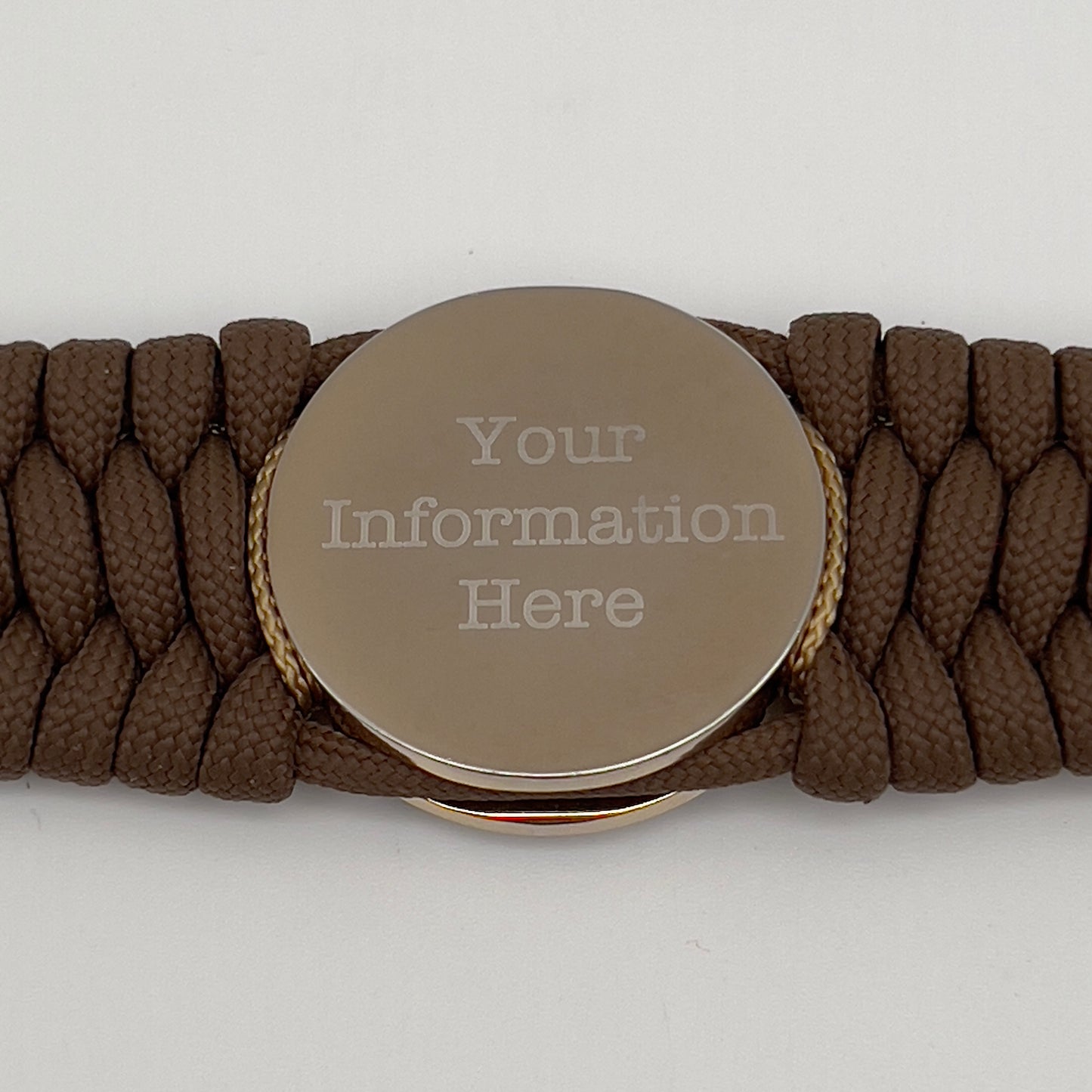 Thick and comfortable braided United States Marine Corps bracelet featuring a 24K gold and silver plated USMC officer Eagle Globe and Anchor medallion, a Cobra style tactical buckle and woven with Coyote Brown 550 paracord and Imperial Red and gold micro cord.