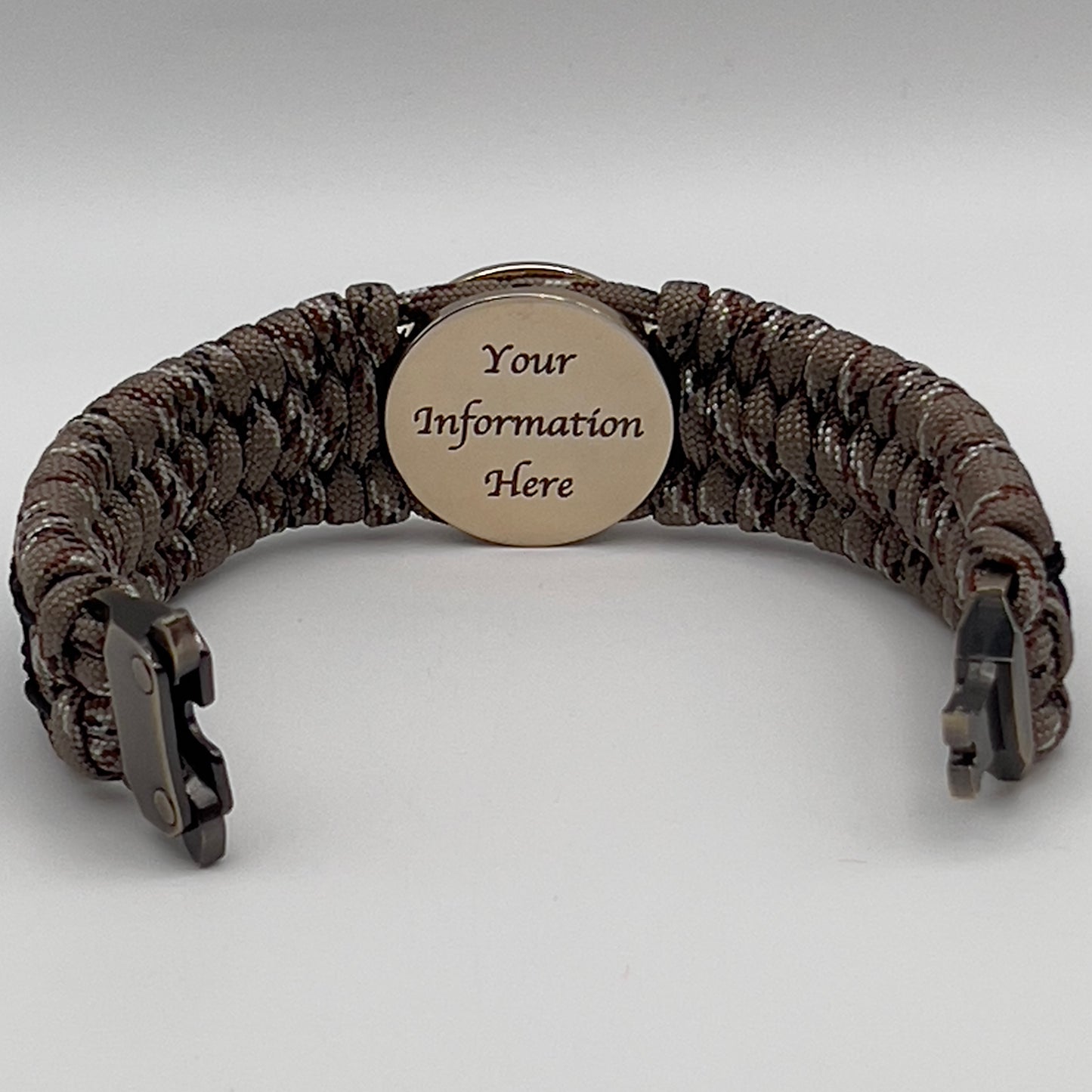 Thick, wide, rigid and comfortable braided United States Marine Corps bracelet featuring a 24K gold plated USMC Eagle Globe and Anchor medallion, a gold Cobra style tactical buckle and woven with Desert Camo 550 paracord and black nano and micro cord.