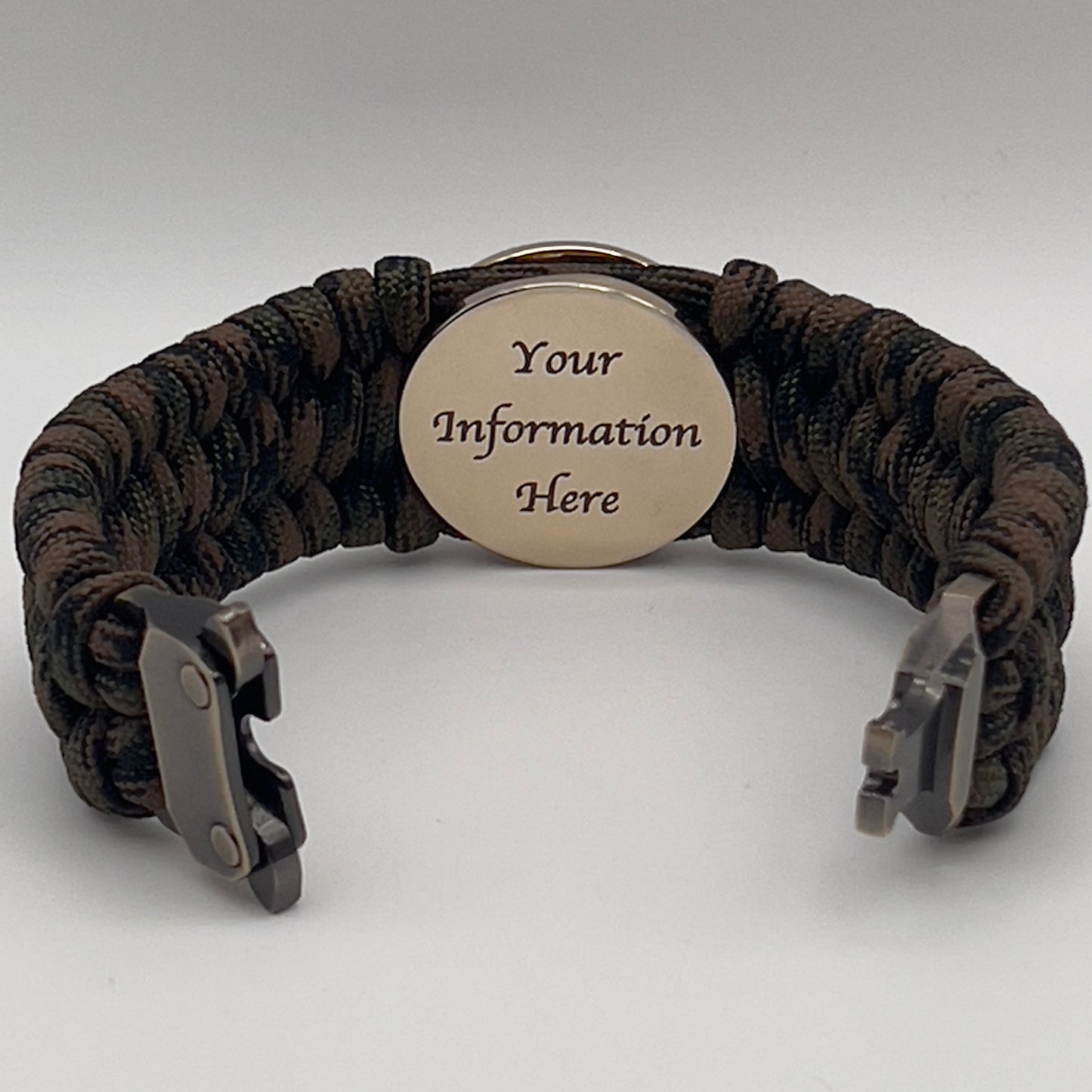 Thick, wide, semi-rigid and comfortable braided United States Marine Corps bracelet featuring a 24K gold plated USMC Eagle Globe and Anchor medallion, a gold Cobra style tactical buckle and woven with Woodland Camo 550 paracord.