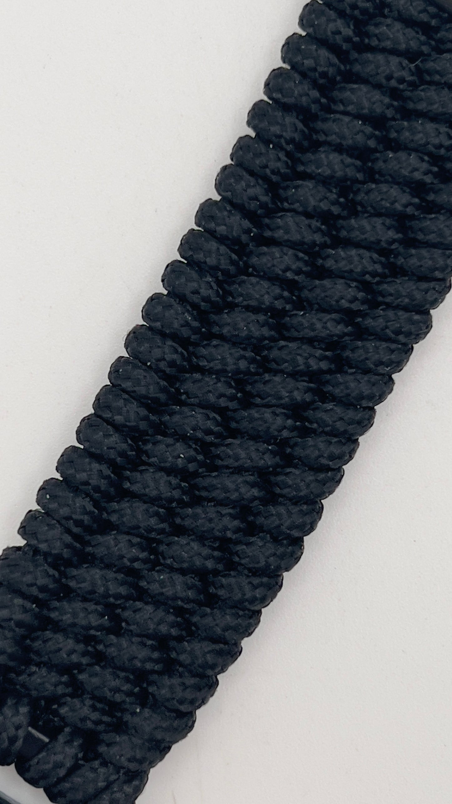 Thin, wide, flexible and comfortable braided US Navy Punisher bracelet featuring a Punisher logo engraving, an antique silver plated Navy medallion, a black Cobra style tactical buckle and woven with black Type-1 paracord.