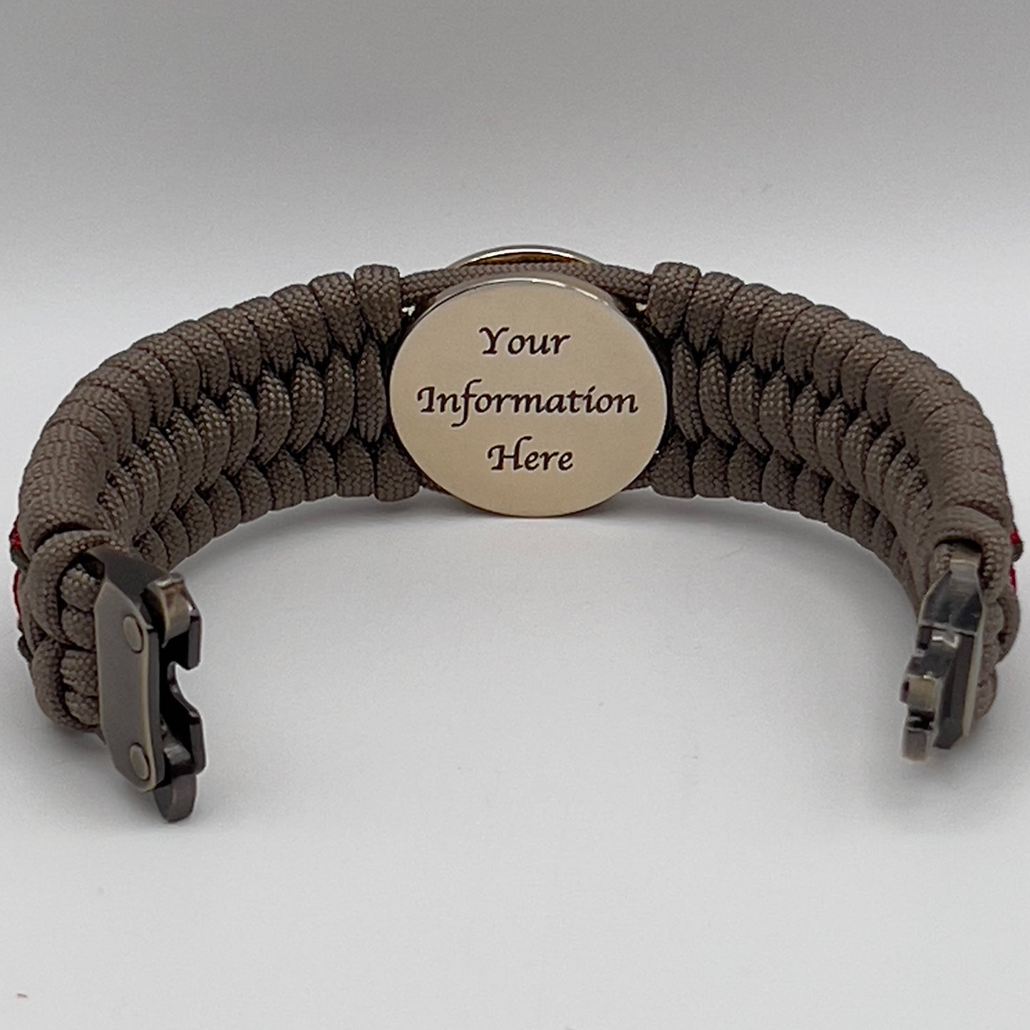 Thick, wide, rigid and comfortable braided United States Marine Corps bracelet featuring a 24K gold plated USMC Eagle Globe and Anchor medallion, a gold Cobra style tactical buckle and woven with tan 550 paracord, olive drab micro and Imperial red nano cord.