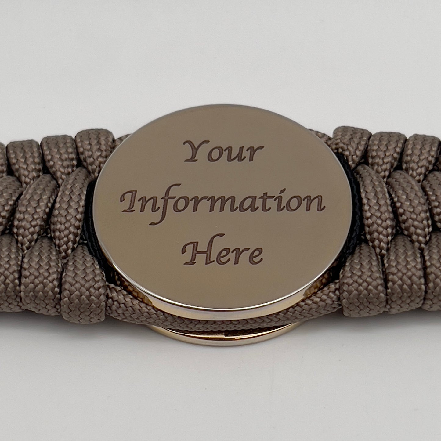 Thick, wide, rigid and comfortable handwoven United States Marine Corps bracelet featuring a 24K gold plated USMC Eagle Globe and Anchor medallion, a gold Cobra style tactical buckle and woven with tna 550 paracord, black micro cord and red nano cord.