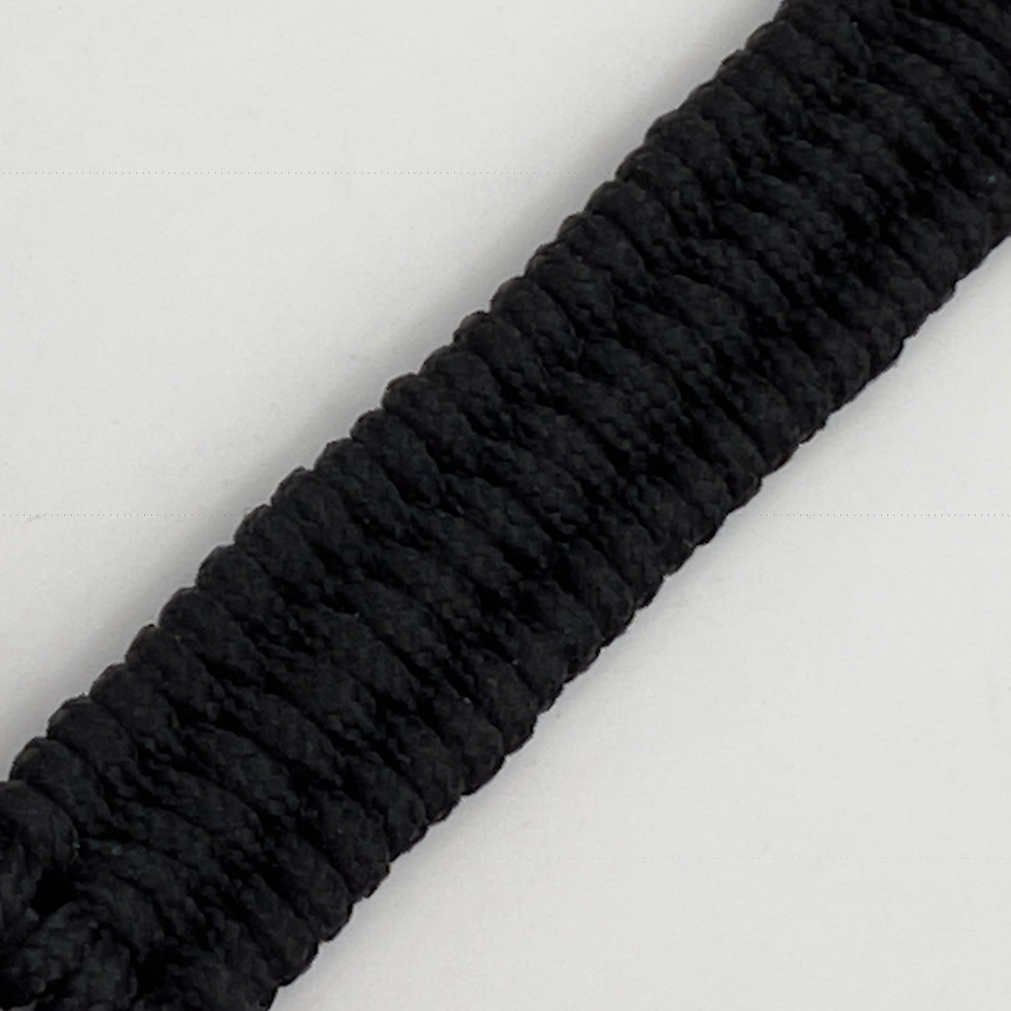 Thick, narrow, flexible and comfortable braided United States Marine Corps bracelet featuring a 24K gold plated USMC officer Eagle Globe and Anchor medallion, a black Cobra style tactical buckle and woven with black Type-1 paracord.