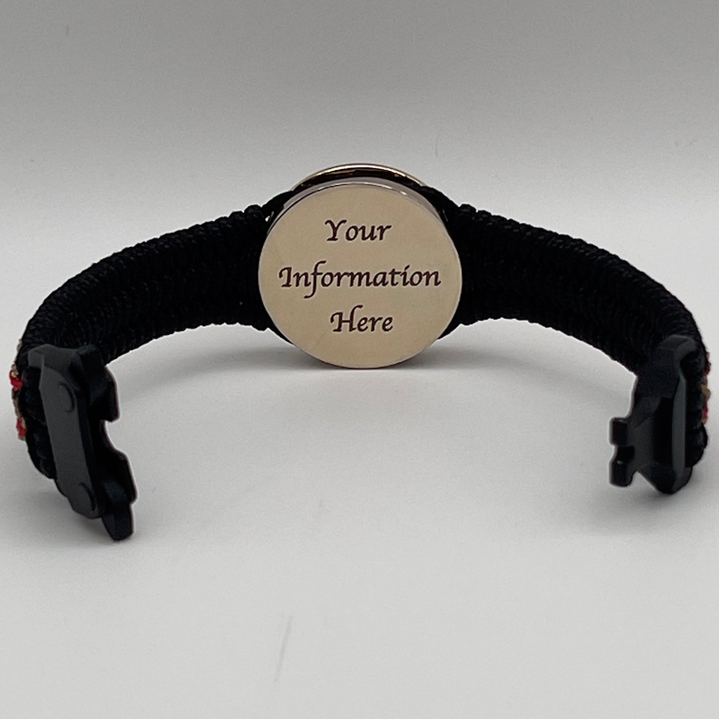 Thin, narrow, flexible and comfortable braided United States Marine Corps bracelet featuring a 24K gold plated USMC Eagle Globe and Anchor medallion, a black Cobra style tactical buckle and woven with black Type-1 paracord and Imperial Red and Gold nano cord.