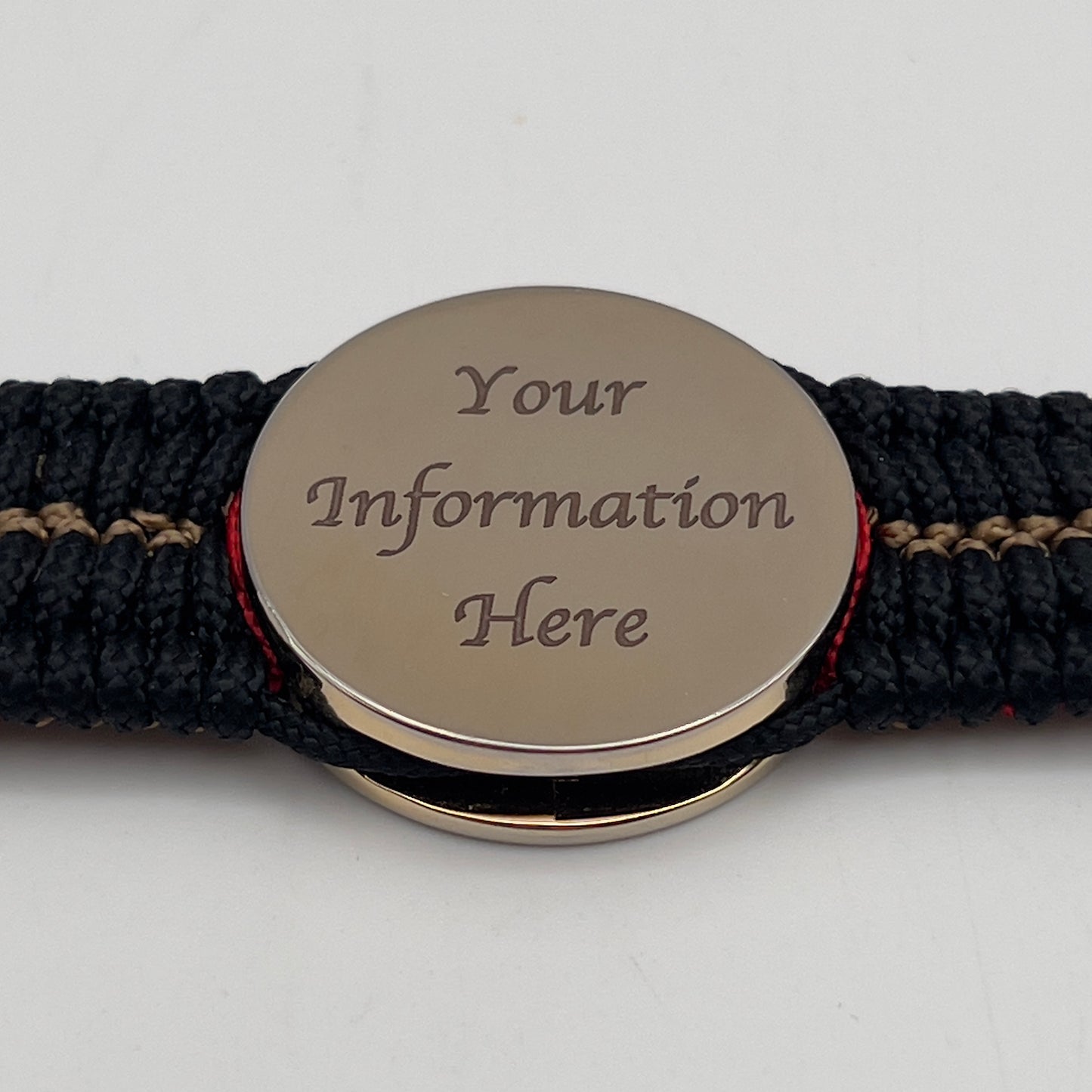Thin, narrow, flexible and comfortable braided United States Marine Corps bracelet featuring a 24K gold plated USMC Eagle Globe and Anchor medallion, a black Cobra style tactical buckle and woven with black Type-1 paracord and Imperial Red and Gold nano cord.