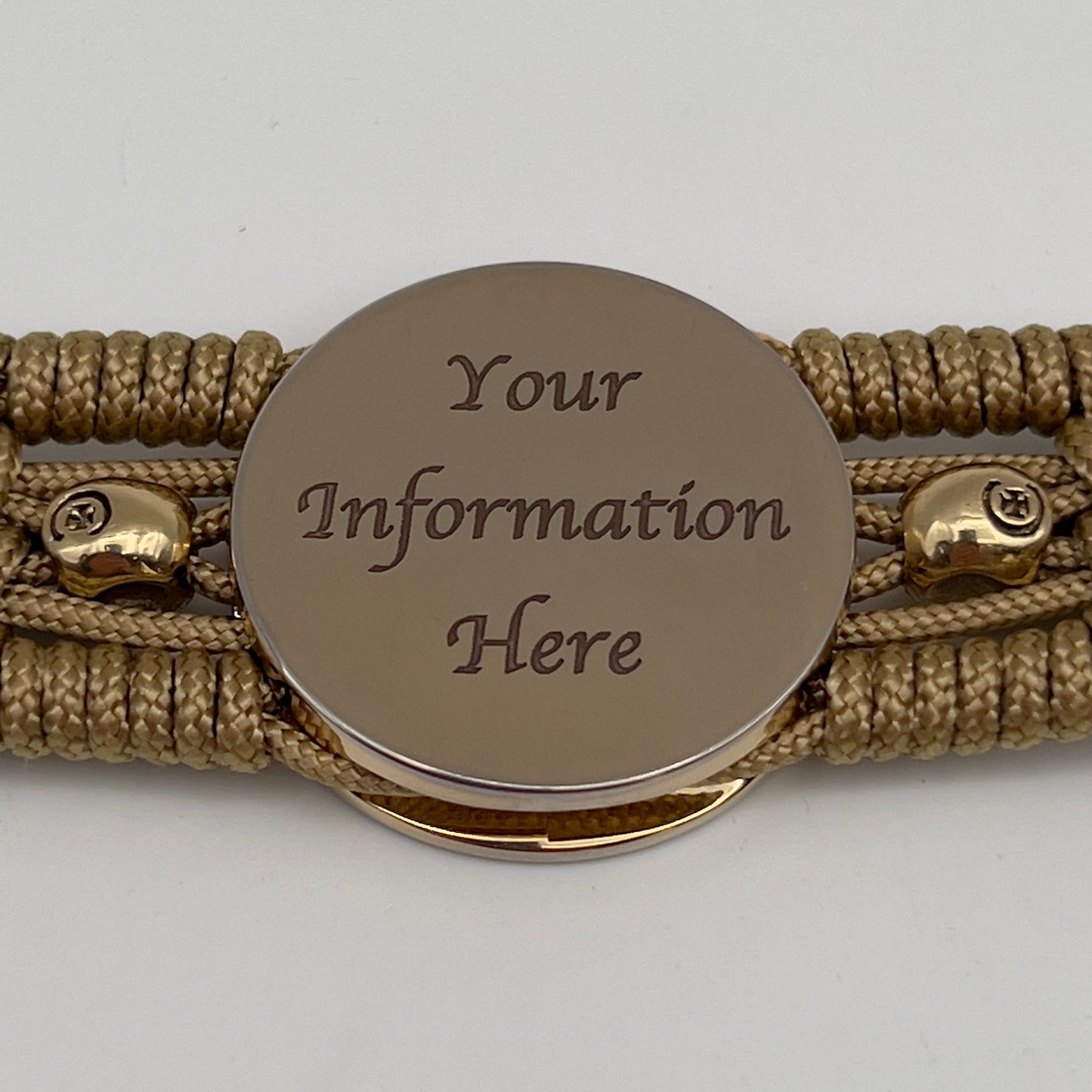 Thin, medium width, flexible and comfortable braided United States Marine Corps bracelet featuring a 24K gold plated USMC officer Eagle Globe and Anchor medallion, two gold plated skulls, a gold Cobra style tactical buckle and woven with gold Type-1 paracord.