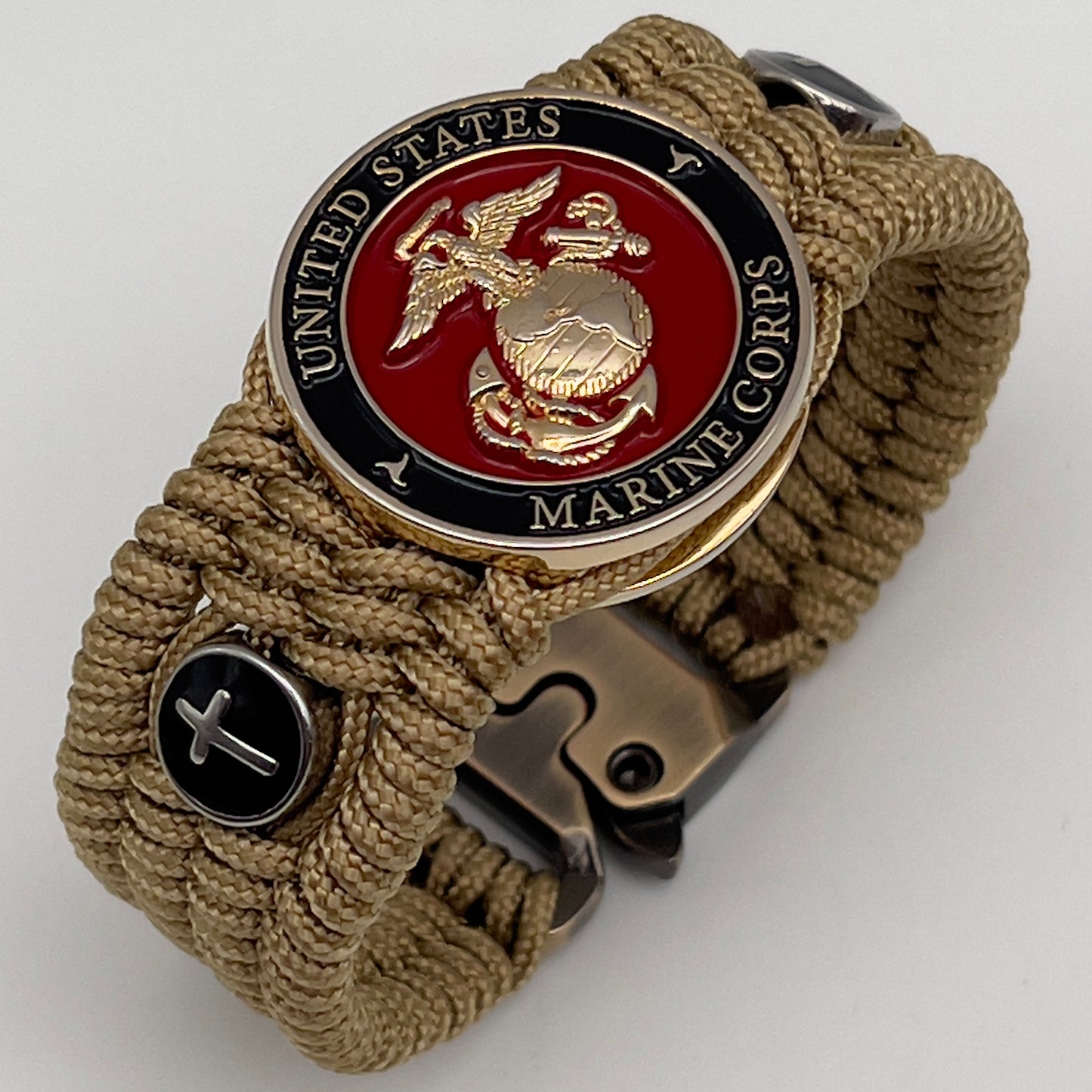 Thin, medium width, flexible and comfortable braided United States Marine Corps bracelet featuring a 24K gold plated USMC officer Eagle Globe and Anchor medallion, two Christian crosses, a gold Cobra style tactical buckle and woven with gold Type-1 paracord.