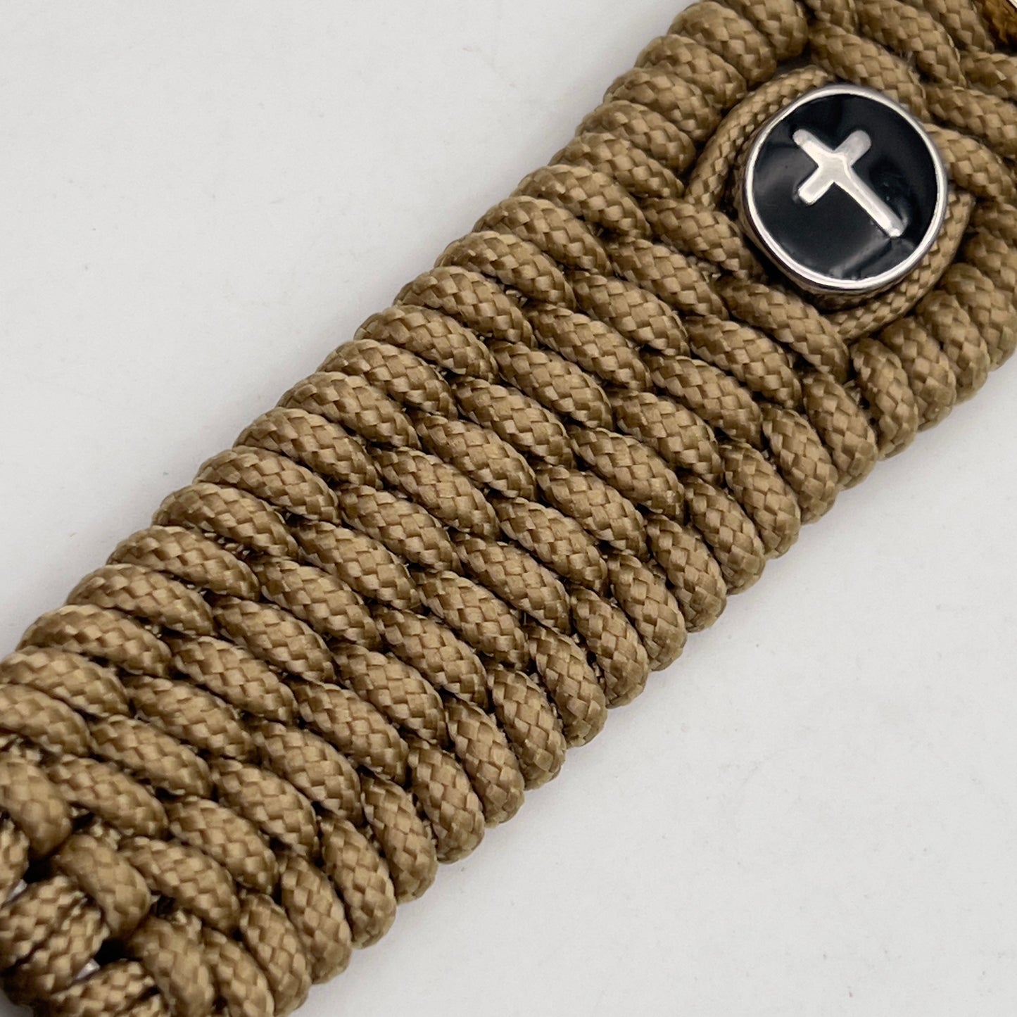 Thin, medium width, flexible and comfortable braided United States Marine Corps bracelet featuring a 24K gold plated USMC officer Eagle Globe and Anchor medallion, two Christian crosses, a gold Cobra style tactical buckle and woven with gold Type-1 paracord.