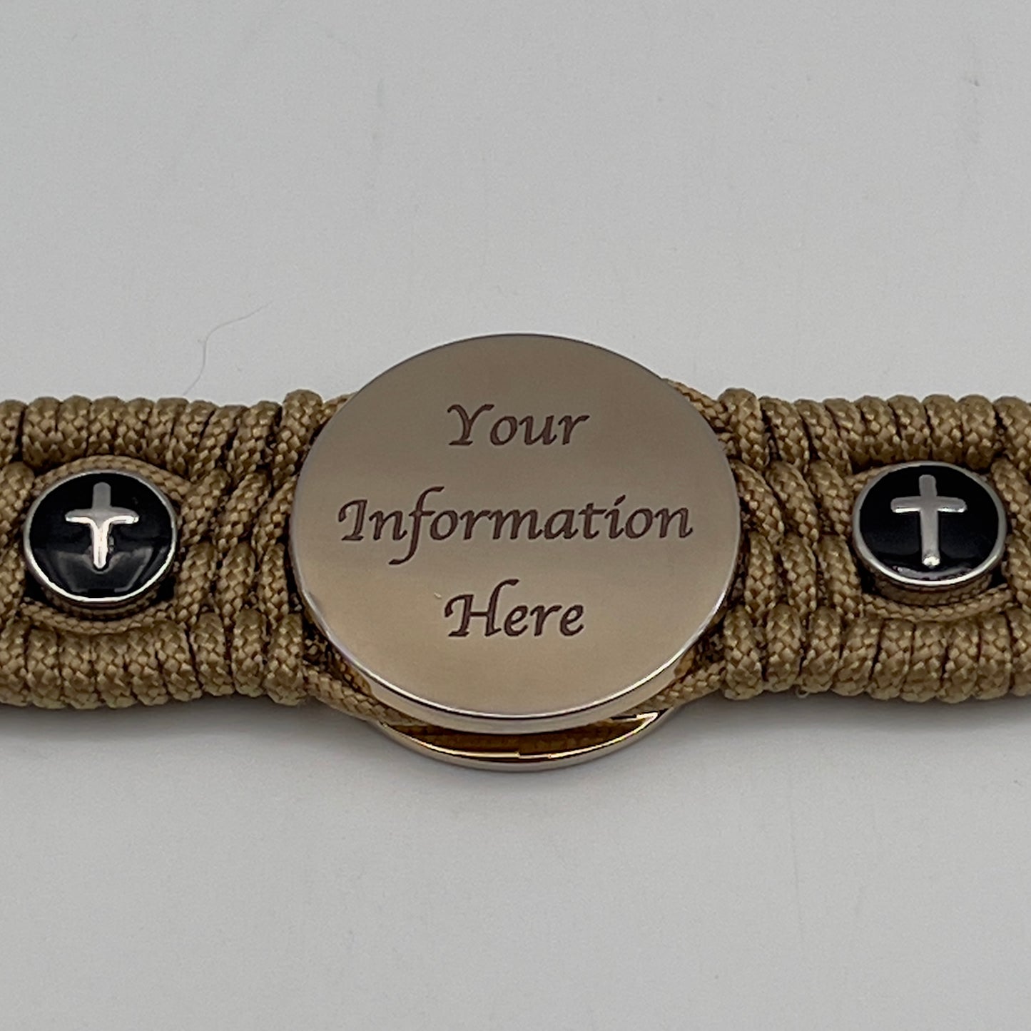 Thin, medium width, flexible and comfortable braided United States Marine Corps bracelet featuring a 24K gold plated USMC officer Eagle Globe and Anchor medallion, two Christian crosses, a gold Cobra style tactical buckle and woven with gold Type-1 paracord.