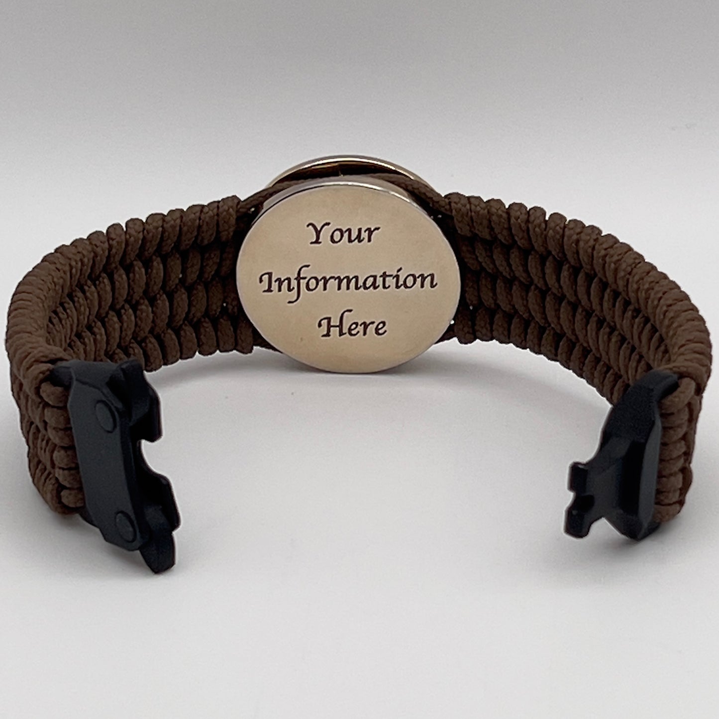 Thin, medium width, flexible and comfortable braided United States Marine Corps bracelet featuring a 24K gold plated USMC officer Eagle Globe and Anchor medallion, a gold Cobra style tactical buckle and woven with Coyote Brown Type-1 paracord.
