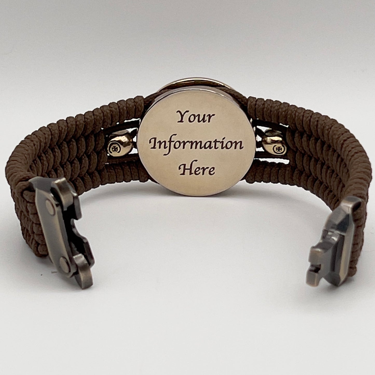 Thin, medium width, flexible and comfortable braided United States Marine Corps bracelet featuring a 24K gold plated USMC officer Eagle Globe and Anchor medallion, two gold plated skulls, a gold Cobra style tactical buckle and woven with Coyote Brown Type-1 paracord.