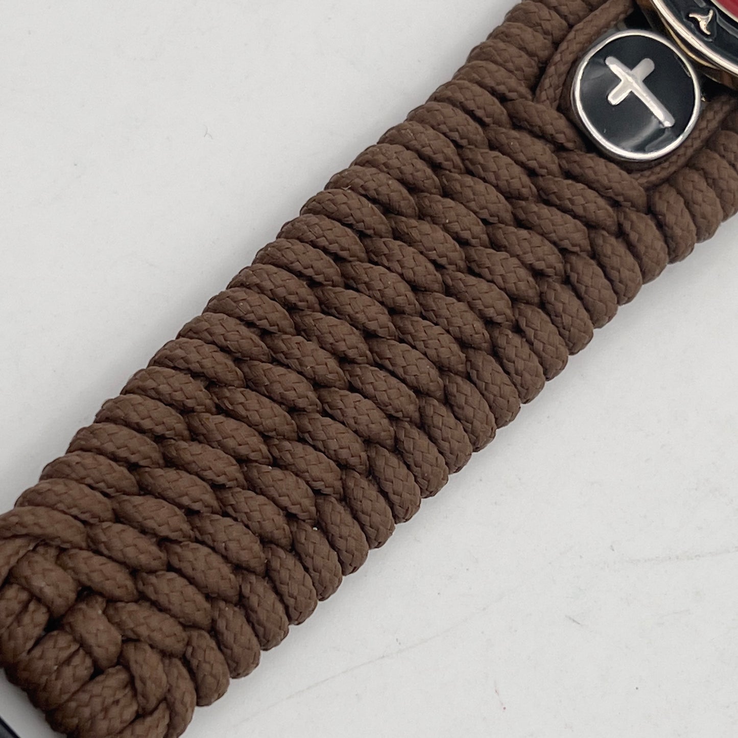 Thin, medium width, flexible and comfortable braided United States Marine Corps bracelet featuring a 24K gold plated USMC officer Eagle Globe and Anchor medallion, two Christian crosses, a black Cobra style tactical buckle and woven with Coyote Brown Type-1 paracord.