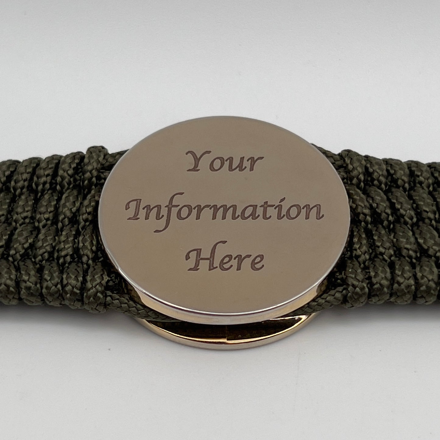 Thin, medium width, flexible and comfortable braided United States Marine Corps bracelet featuring a 24K gold plated USMC officer Eagle Globe and Anchor medallion, a gold Cobra style tactical buckle and woven with Olive Drab Type-1 paracord.
