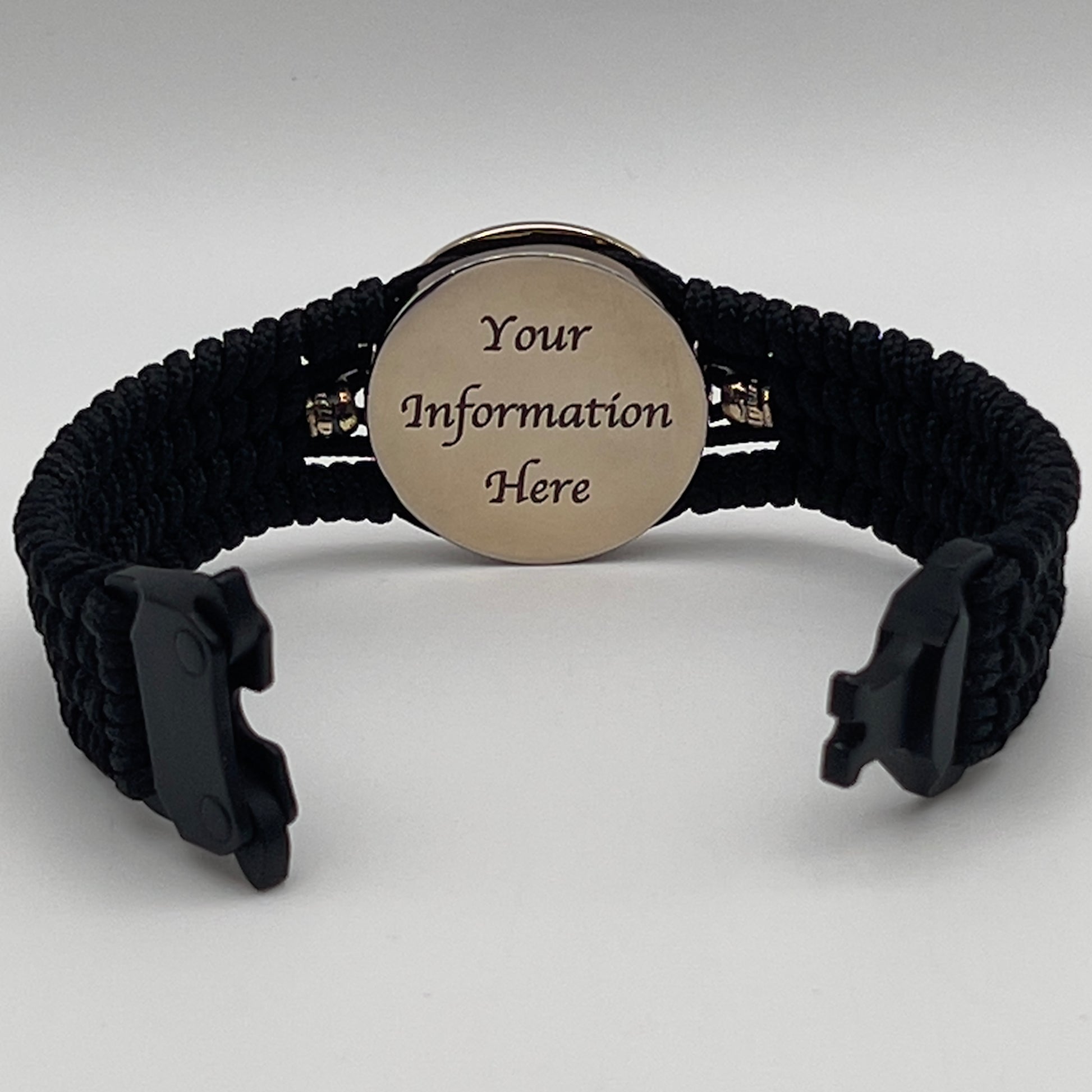 Thin, medium width, flexible and comfortable braided United States Marine Corps bracelet featuring a 24K gold plated USMC officer Eagle Globe and Anchor medallion, two brass Spartan helmets, a black Cobra style tactical buckle and woven with black Type-1 paracord.