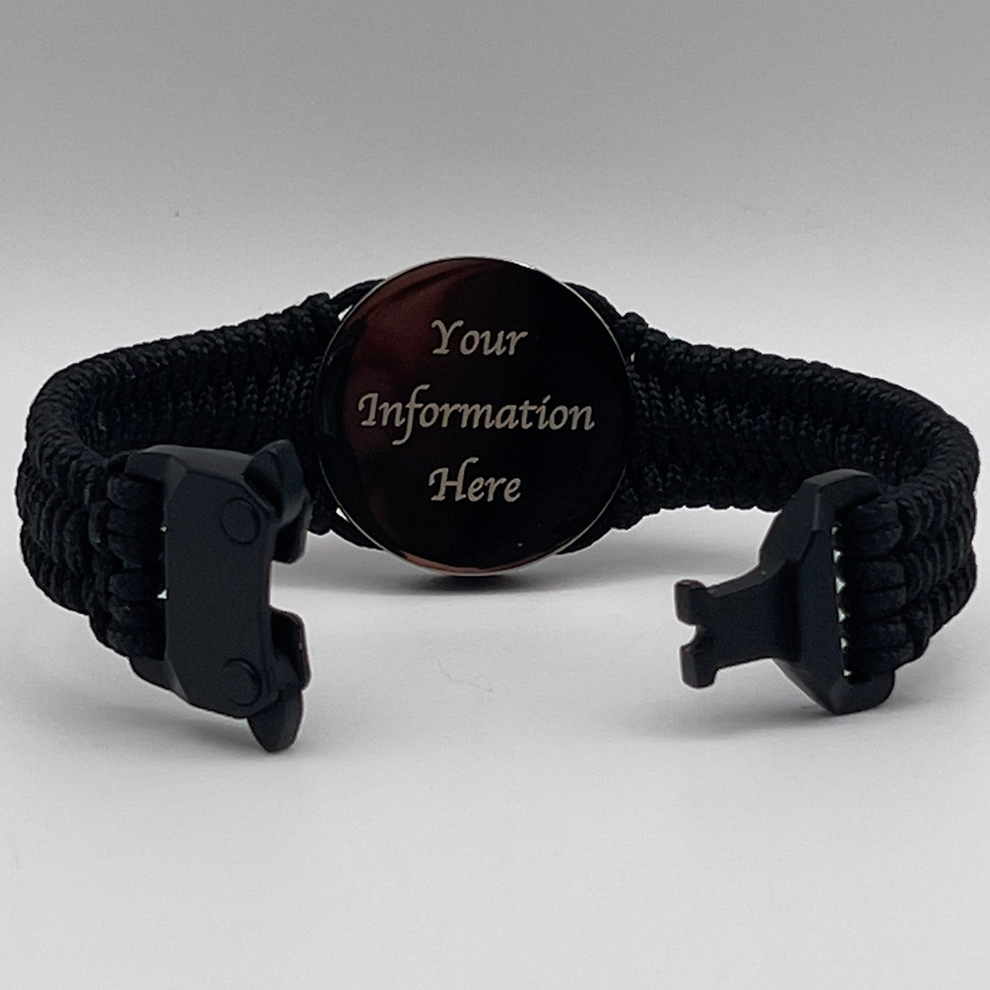 Thin, narrow, flexible and comfortable braided United States Marine Corps Recruit Depot Yellow Footprints bracelet featuring a black nickel plated UV enamel painted medallion replica of an actual set of USMC footprints, a black Cobra style tactical buckle and woven with black Type-1 paracord.