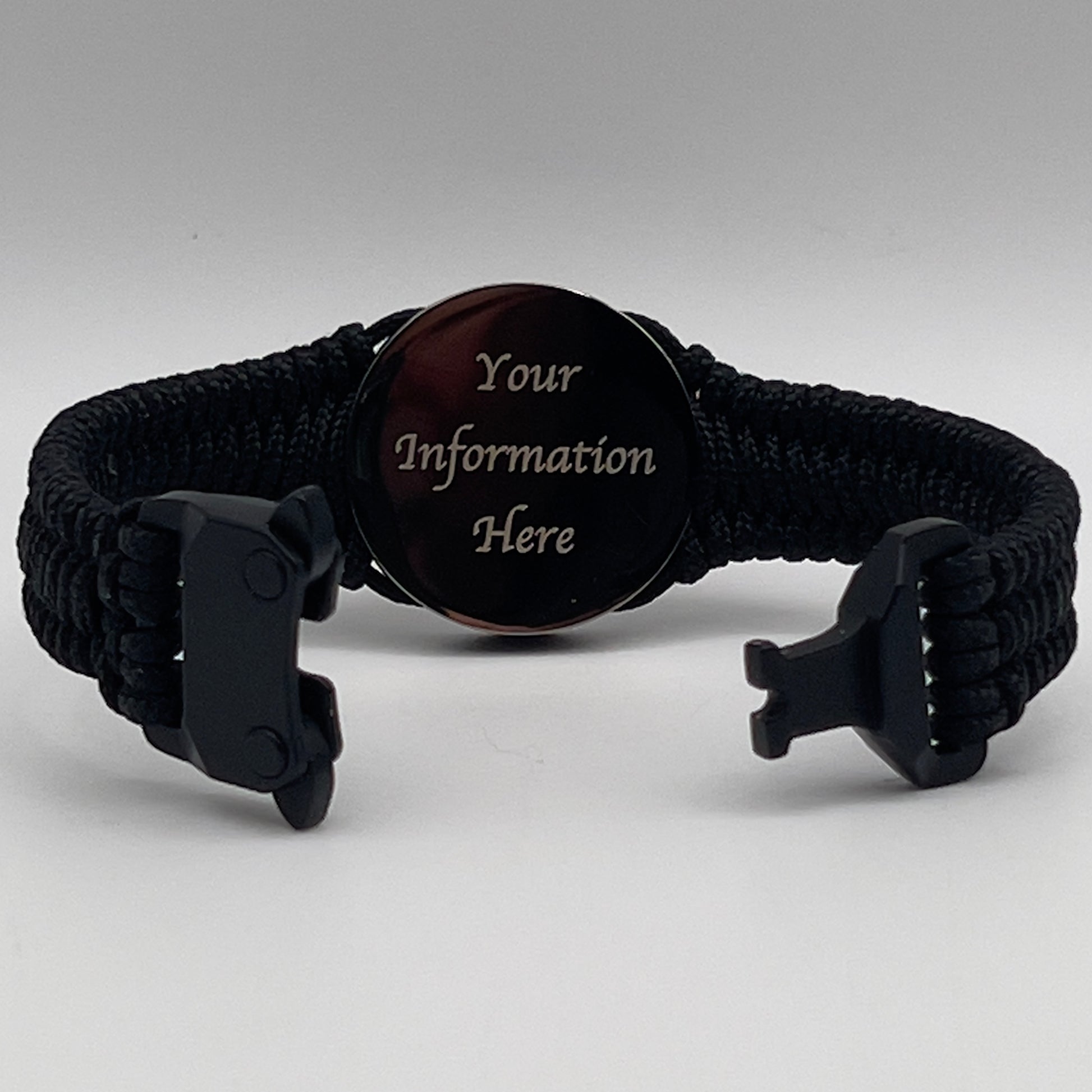 Thin, narrow, flexible and comfortable braided United States Marine Corps Recruit Depot Yellow Footprints bracelet featuring a black nickel plated UV enamel painted medallion replica of an actual set of USMC footprints, a black Cobra style tactical buckle and woven with black Type-1 paracord.
