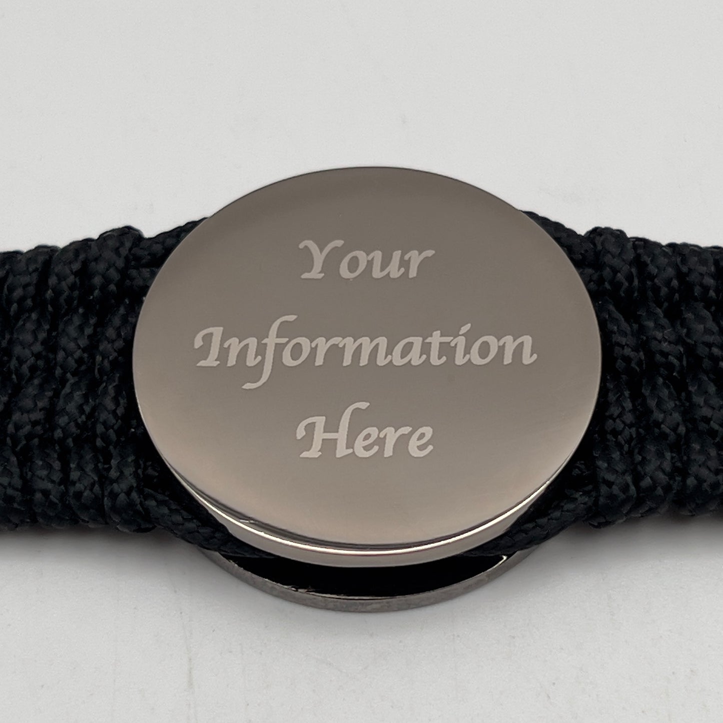 Thin, wide, flexible and comfortable braided United States Marine Corps Recruit Depot Yellow Footprints bracelet featuring a black nickel plated UV enamel painted medallion replica of an actual set of USMC footprints, a black Cobra style tactical buckle and woven with black Type-1 paracord.