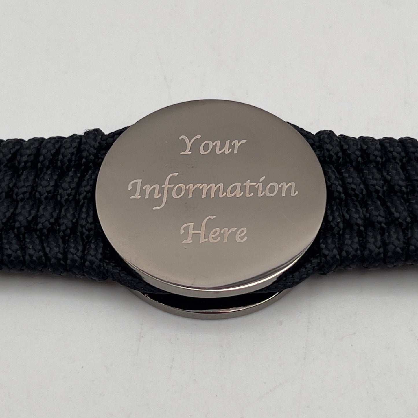 Thin, wide, flexible and comfortable braided United States Marine Corps Recruit Depot Yellow Footprints bracelet featuring a black nickel plated UV enamel painted medallion replica of an actual set of USMC footprints, a black Cobra style tactical buckle and woven with black Type-1 paracord.