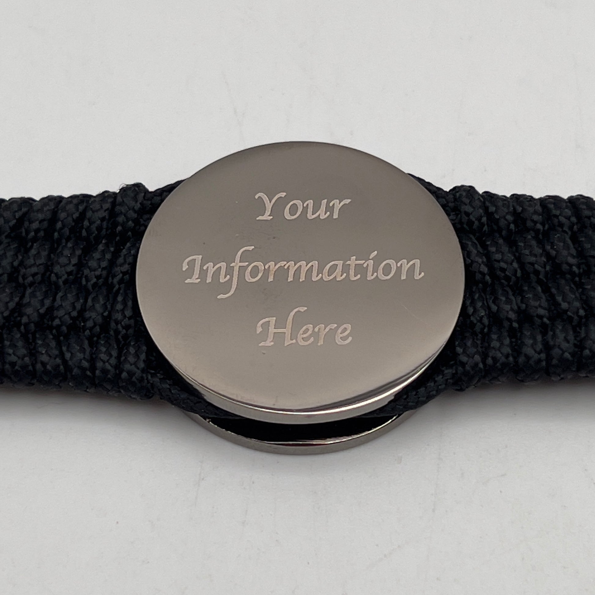 Thin, wide, flexible and comfortable braided United States Marine Corps Recruit Depot Yellow Footprints bracelet featuring a black nickel plated UV enamel painted medallion replica of an actual set of USMC footprints, a black Cobra style tactical buckle and woven with black Type-1 paracord.