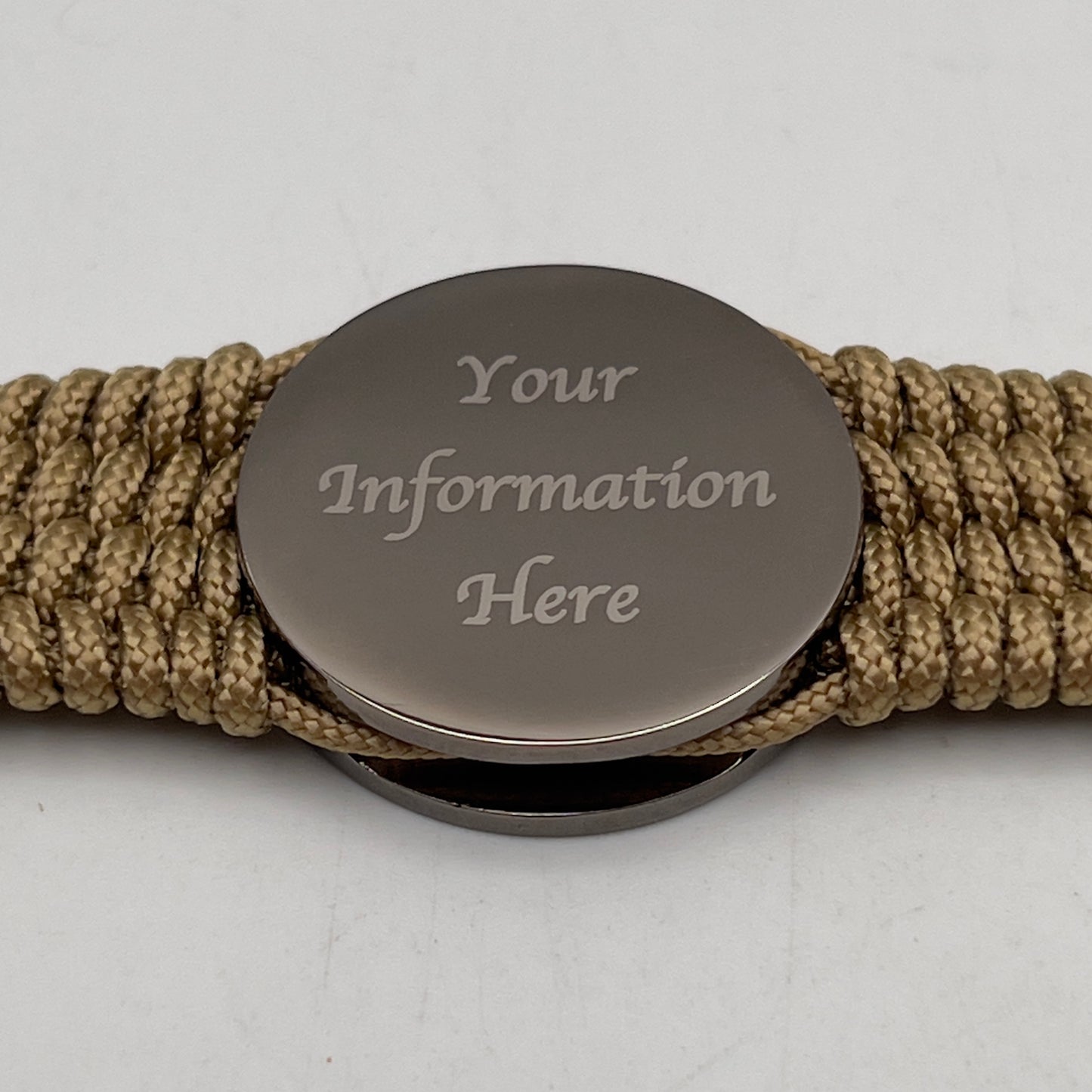 Thin, wide, flexible and comfortable braided United States Marine Corps Recruit Depot Yellow Footprints bracelet featuring a black nickel plated UV enamel painted medallion replica of an actual set of USMC footprints, a gold Cobra style tactical buckle and woven with gold Type-1 paracord.