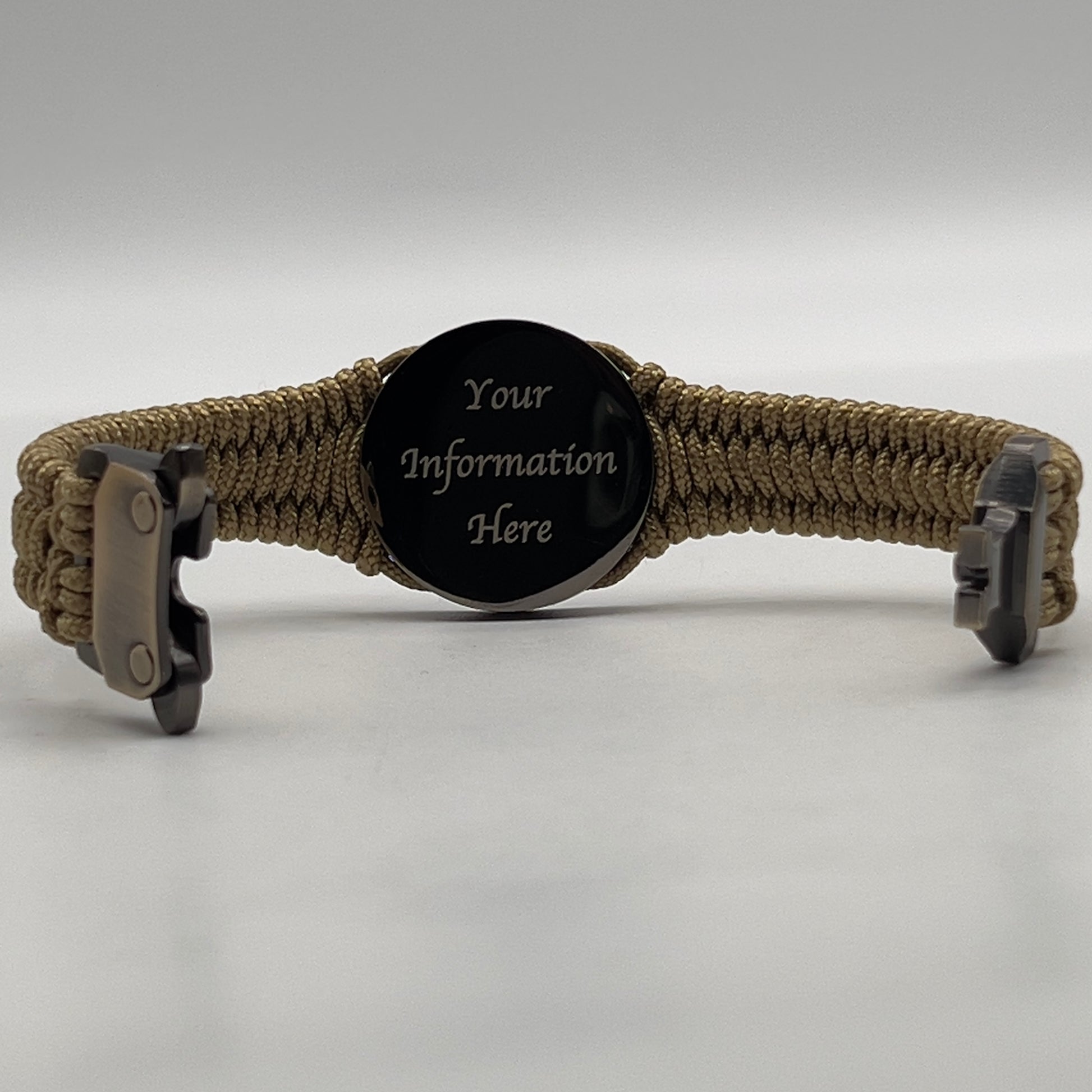 Thin, narrow, flexible and comfortable braided United States Marine Corps Recruit Depot Yellow Footprints bracelet featuring a black nickel plated UV enamel painted medallion replica of an actual set of USMC footprints, a gold Cobra style tactical buckle and woven with gold Type-1 paracord.
