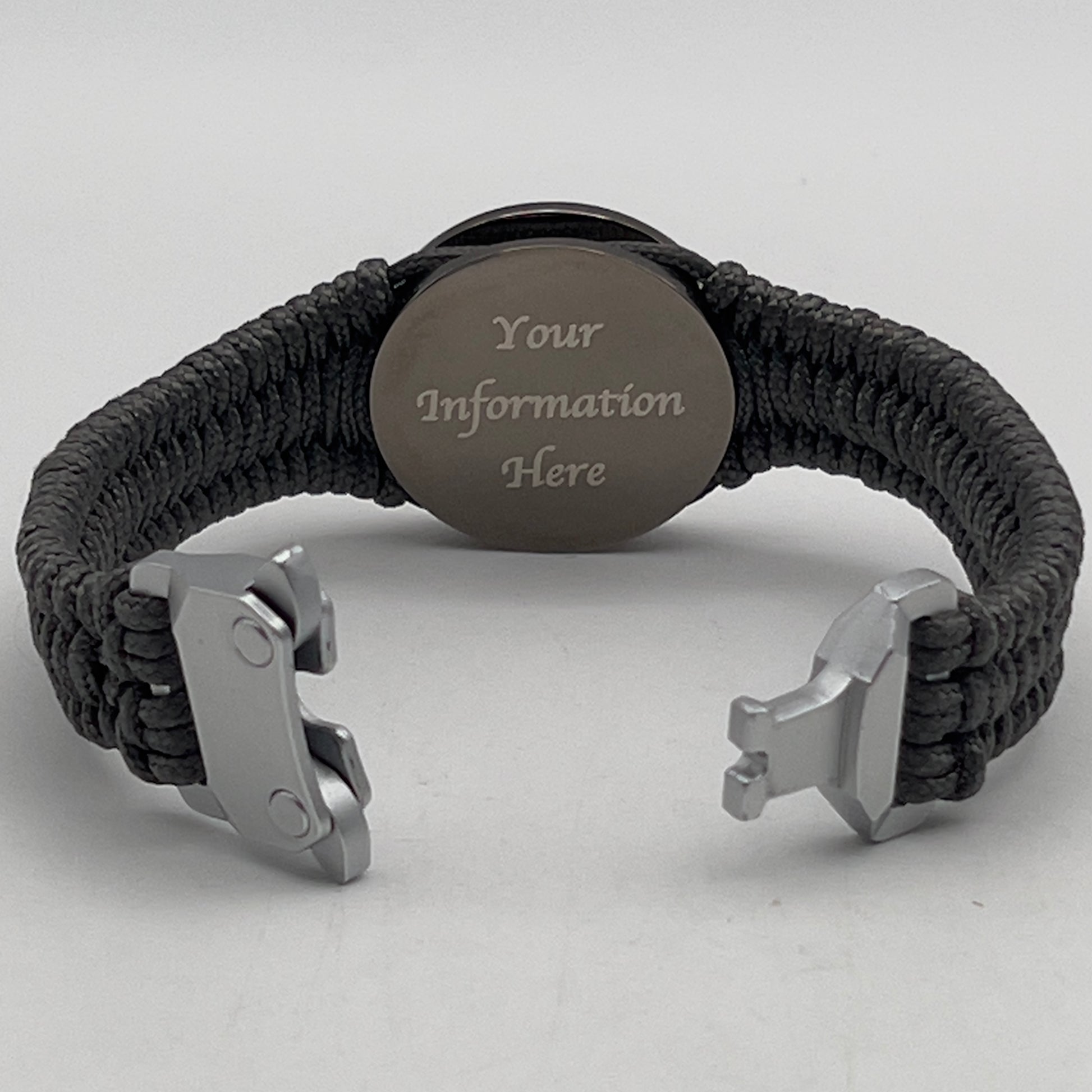 Thin, narrow, flexible and comfortable braided United States Marine Corps Recruit Depot Yellow Footprints bracelet featuring a black nickel plated UV enamel painted medallion replica of an actual set of USMC footprints, a silver Cobra style tactical buckle and woven with Charcoal Gray Type-1 paracord.
