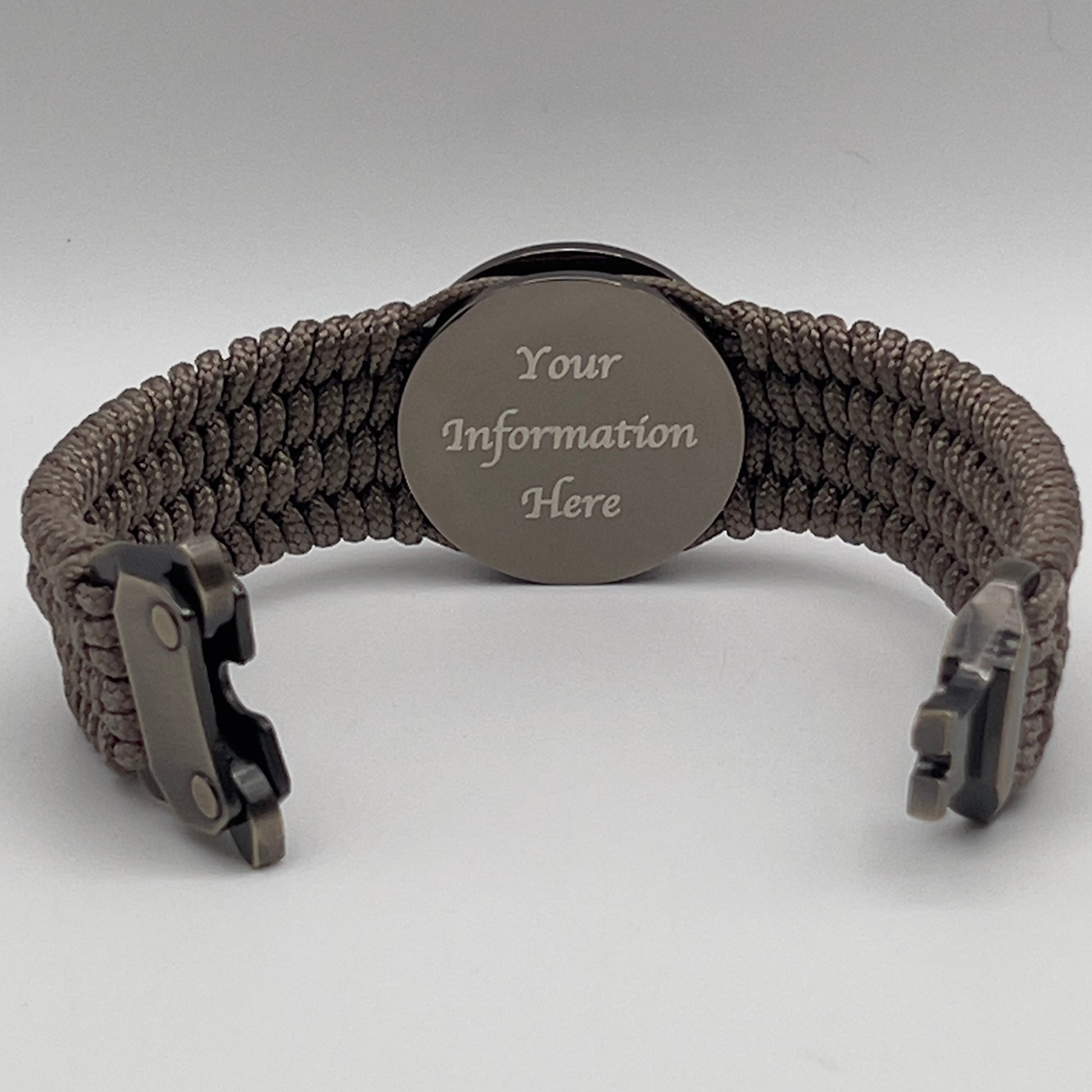 Thin, wide, flexible and comfortable braided United States Marine Corps Recruit Depot Yellow Footprints bracelet featuring a black nickel plated UV enamel painted medallion replica of an actual set of USMC recruit depot footprints, a gold Cobra style tactical buckle and woven with tan Type-1 paracord.