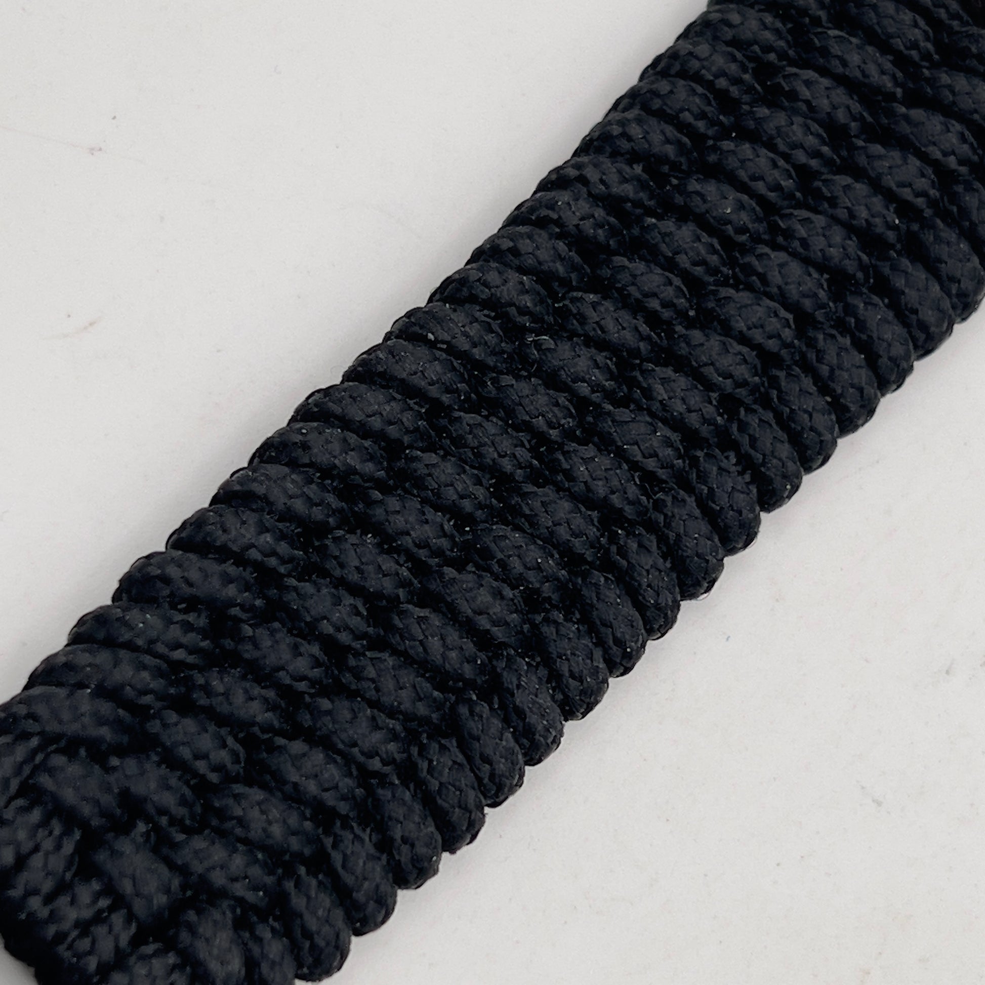 Thin, wide, flexible and comfortable braided United States Marine Corps bracelet featuring a 24K gold and silver plated USMC Eagle Globe and Anchor medallion, a black Cobra style tactical buckle and woven with black type-1 paracord.