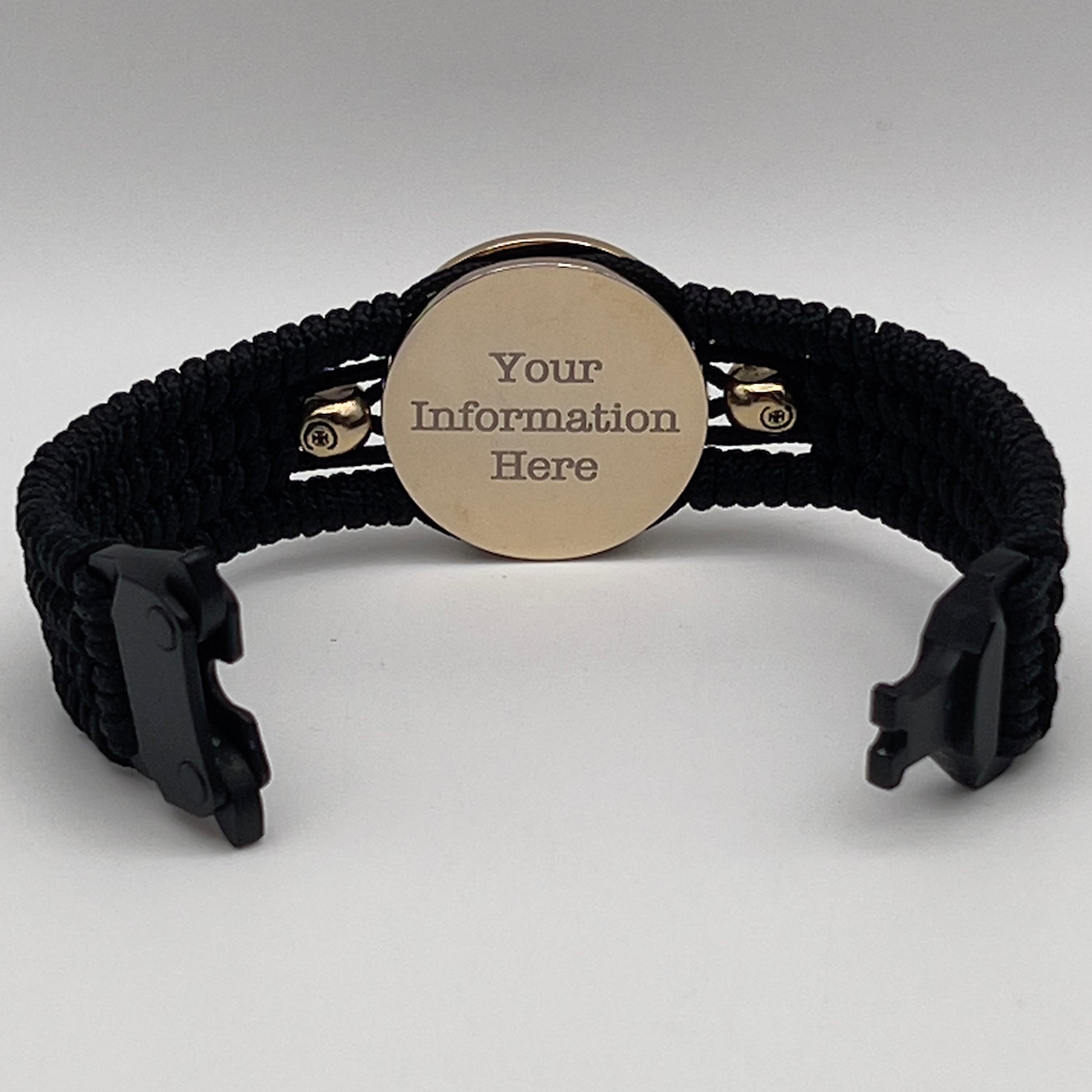 Thin, medium width, flexible and comfortable braided United States Marine Corps bracelet featuring a 24K gold and silver plated USMC officer Eagle Globe and Anchor medallion, two brass micro Spartan helmets, a black Cobra style tactical buckle and woven with black type-1 paracord.
