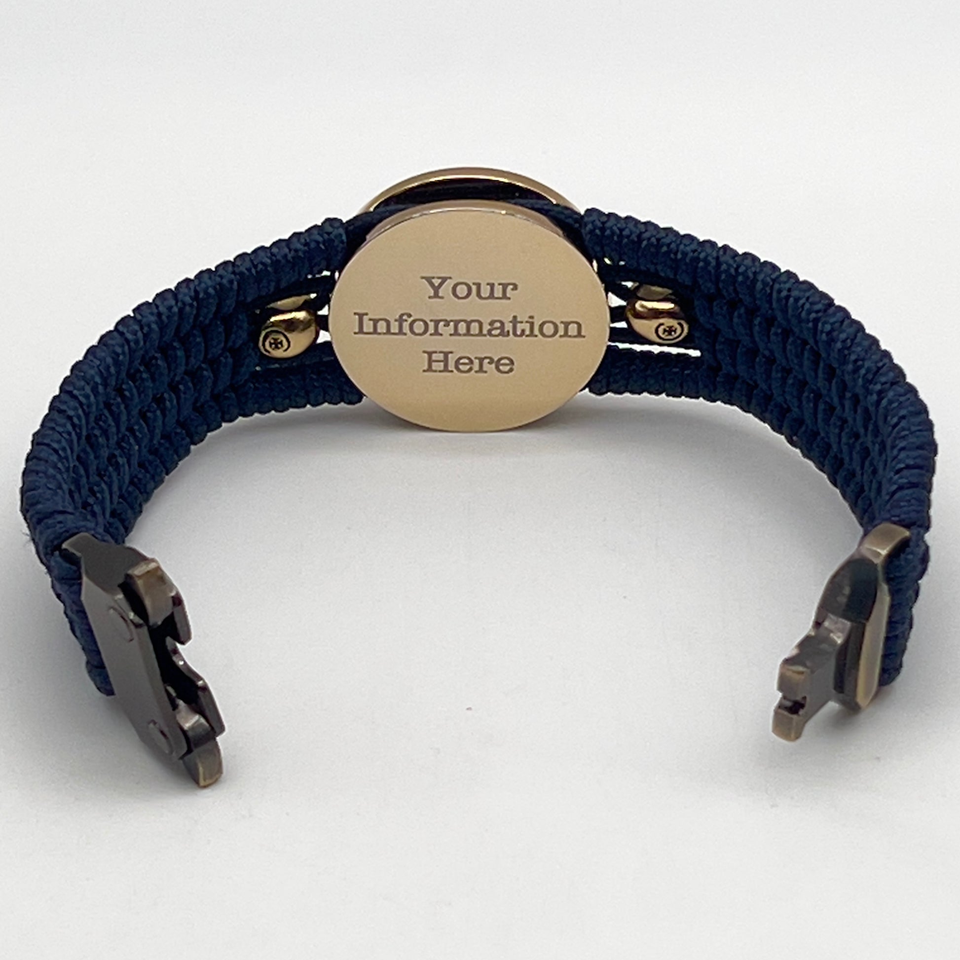 Thin, medium width, flexible and comfortable braided United States Marine Corps bracelet featuring a 24K gold and silver plated USMC officer Eagle Globe and Anchor medallion, two gold micro skulls, a gold Cobra style tactical buckle and woven with Navy blue type-1 paracord.