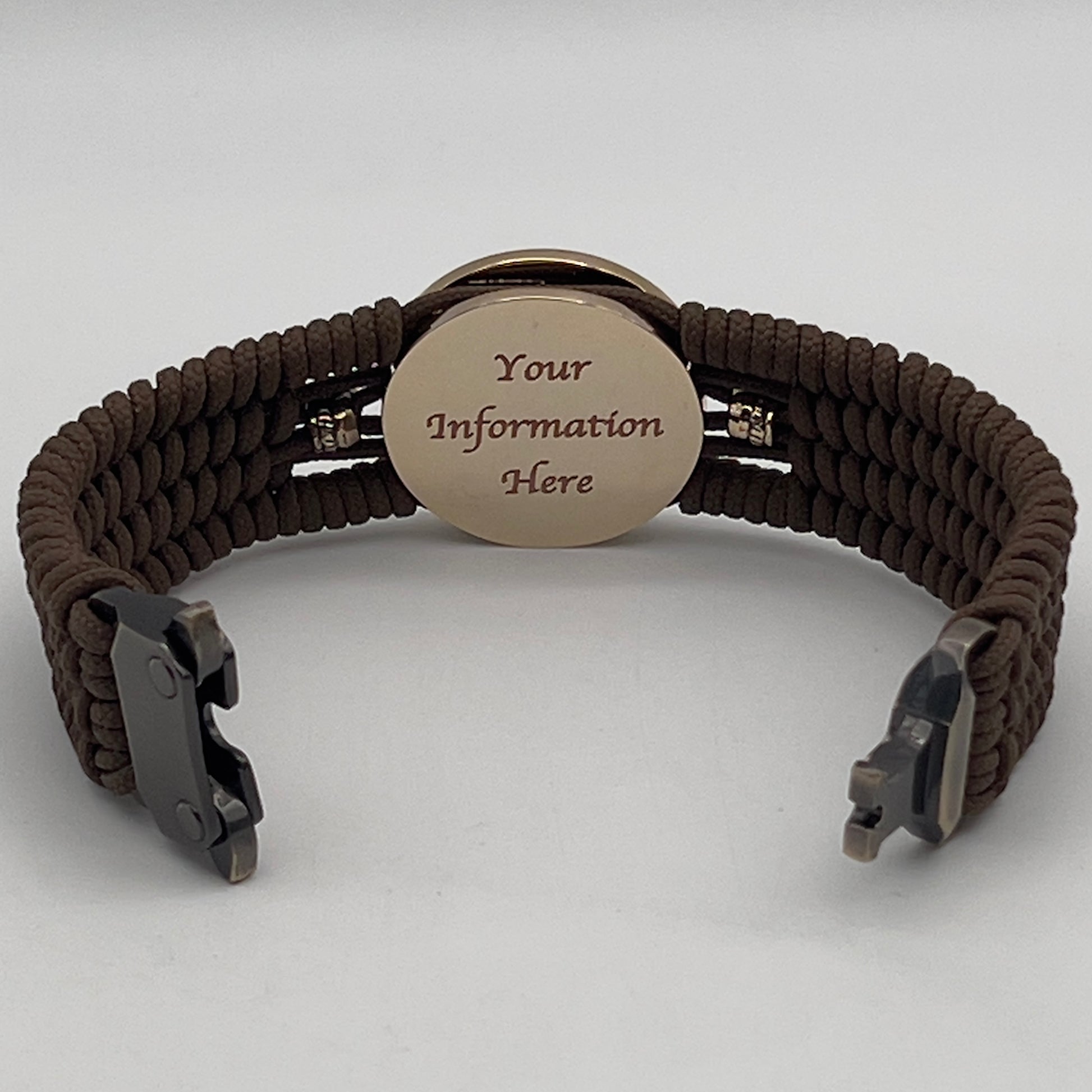 Thin, medium width, flexible and comfortable braided United States Marine Corps bracelet featuring a 24K gold and silver plated USMC officer Eagle Globe and Anchor medallion, two brass micro Spartan helmets, a gold Cobra style tactical buckle and woven with Coyote Brown type-1 paracord.