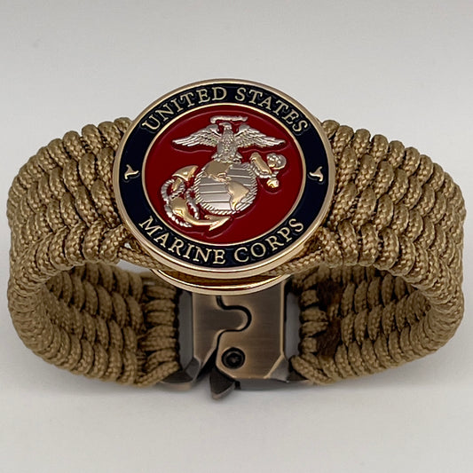 Thin, wide, flexible and comfortable braided United States Marine Corps bracelet featuring a 24K gold and silver plated USMC Eagle Globe and Anchor medallion, a gold Cobra style tactical buckle and woven with gold type-1 paracord.