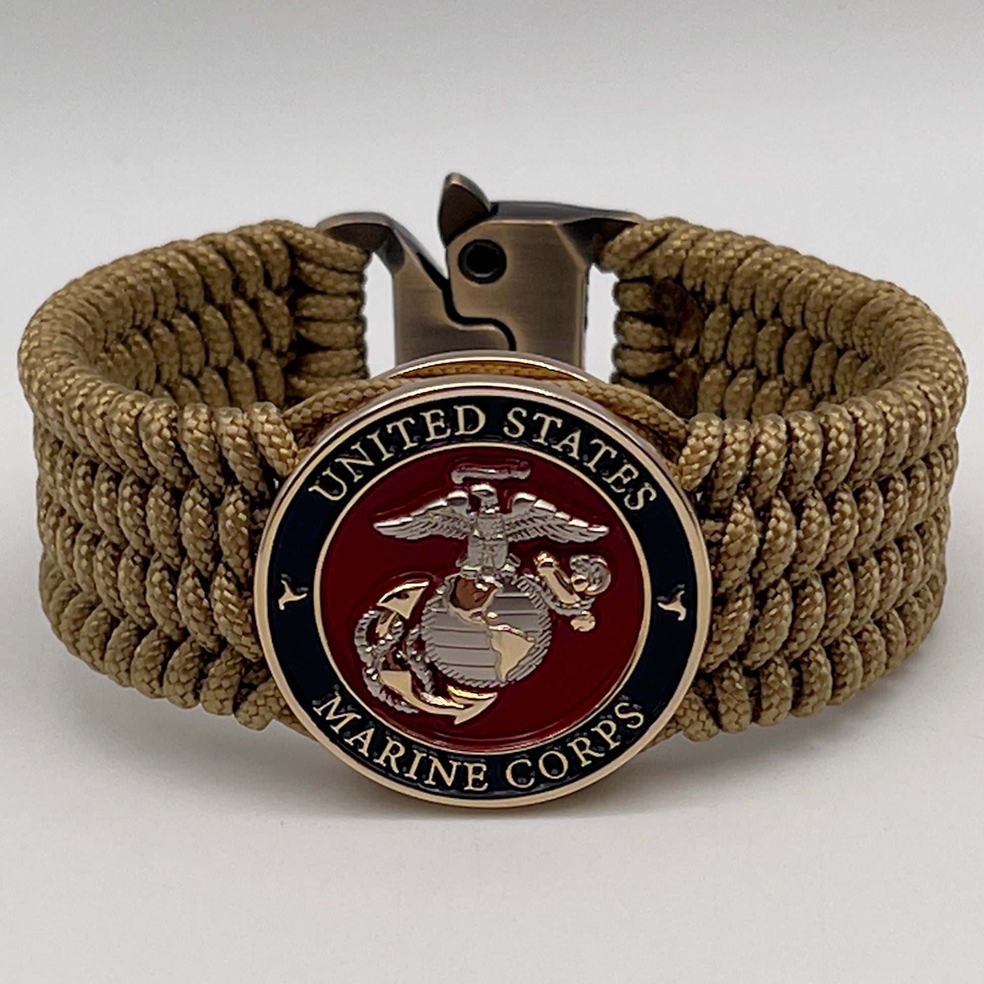 Thin, wide, flexible and comfortable braided United States Marine Corps bracelet featuring a 24K gold and silver plated USMC Eagle Globe and Anchor medallion, a gold Cobra style tactical buckle and woven with gold type-1 paracord.