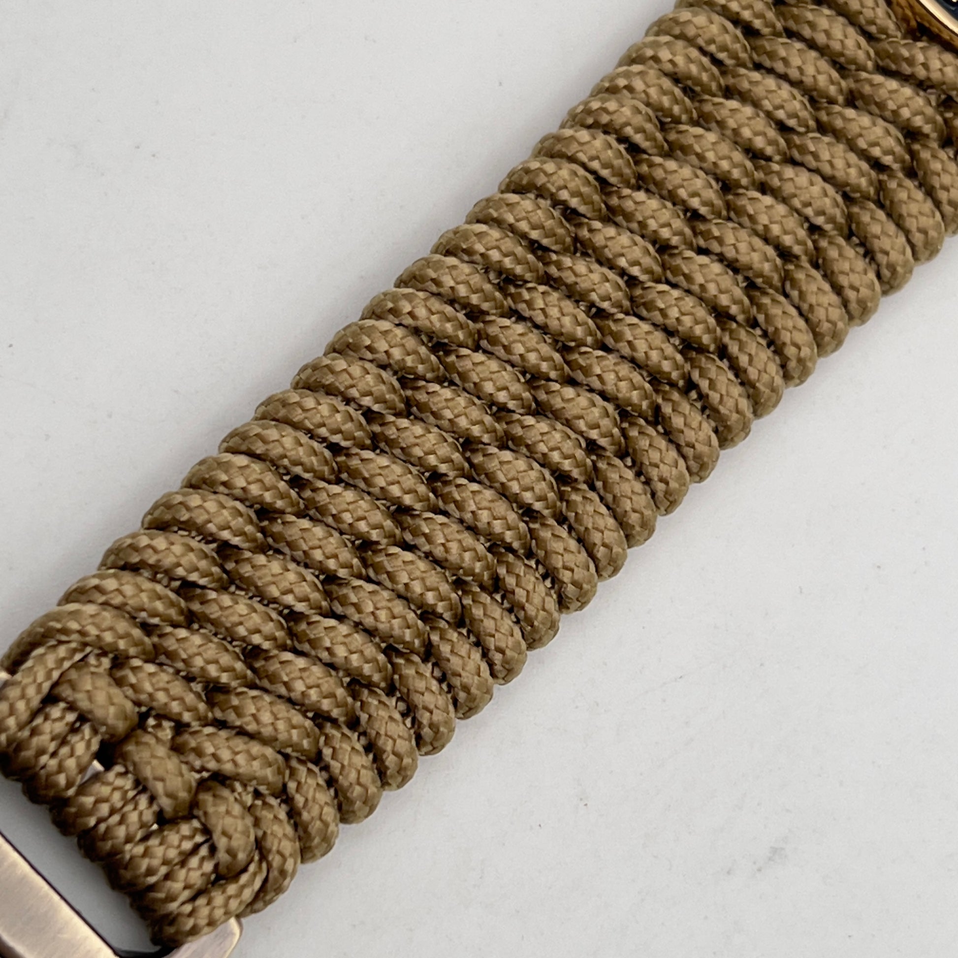 Thin, wide, flexible and comfortable braided United States Marine Corps bracelet featuring a 24K gold and silver plated USMC Eagle Globe and Anchor medallion, a gold Cobra style tactical buckle and woven with gold type-1 paracord.