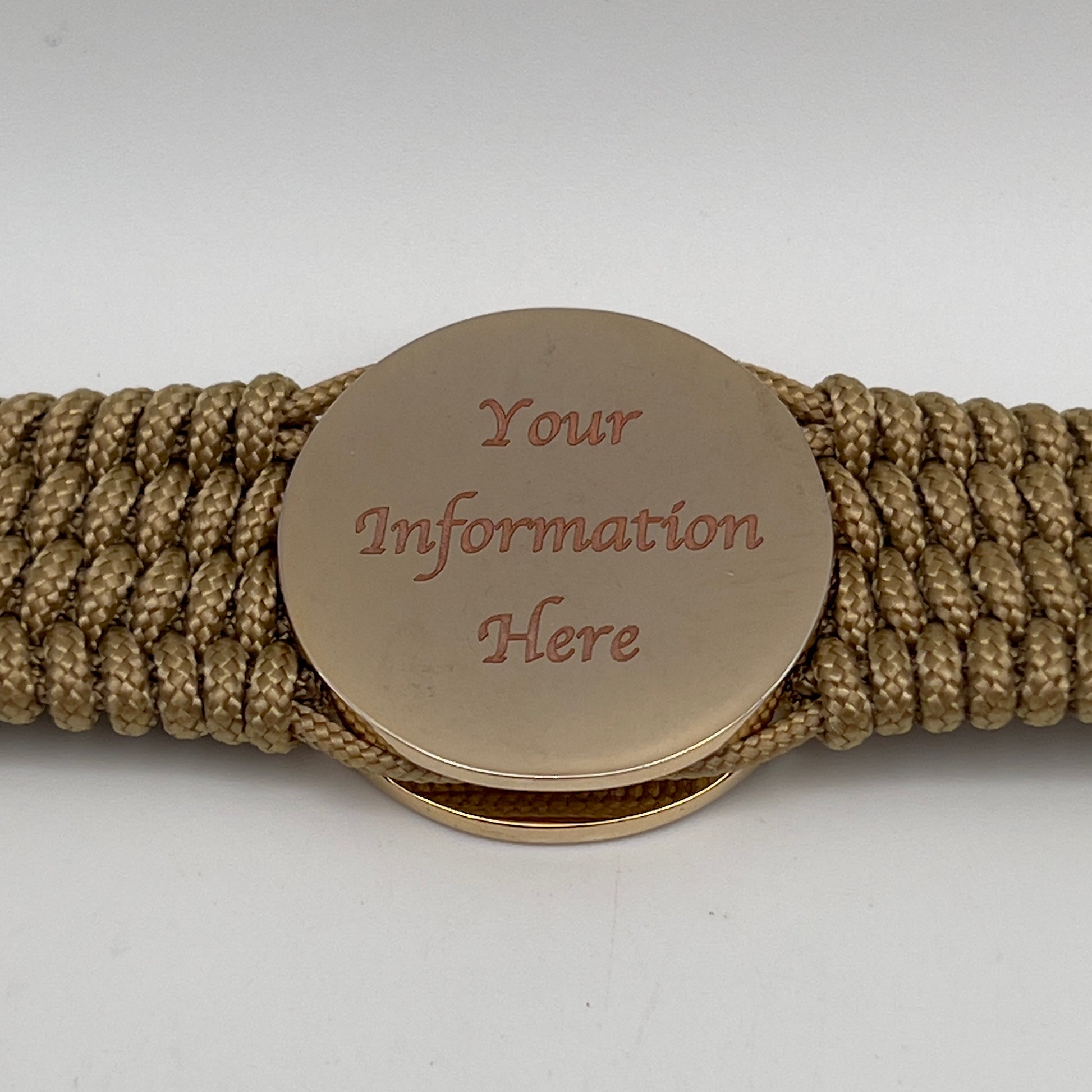 Thin, wide, flexible and comfortable braided United States Marine Corps bracelet featuring a 24K gold and silver plated USMC Eagle Globe and Anchor medallion, a gold Cobra style tactical buckle and woven with gold type-1 paracord.