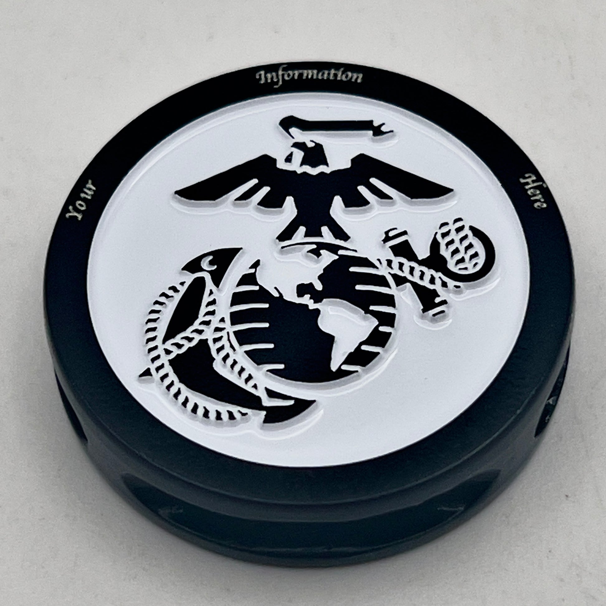 Thin, medium width, flexible and comfortable braided United States Marine Corps bracelet featuring a black USMC Eagle Globe and Anchor medallion, a black Cobra style tactical buckle and woven with black Type-1 paracord and stitched with red and blue nano cord.
