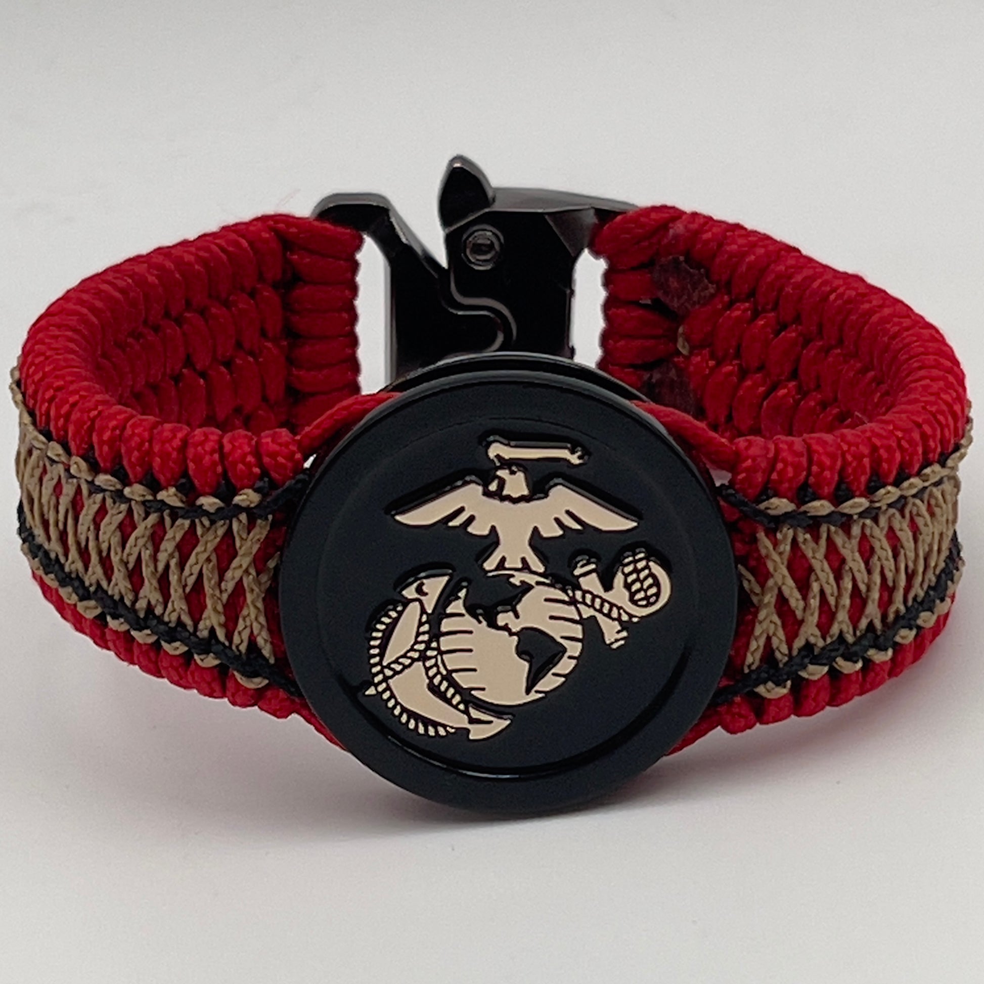Thin, narrow, flexible and comfortable braided United States Marine Corps bracelet featuring the official US Marine Corps Eagle, Globe and Anchor medallion, a black Cobra style tactical buckle and woven with red Type-1 paracord and center stitched with black and gold nano cord.