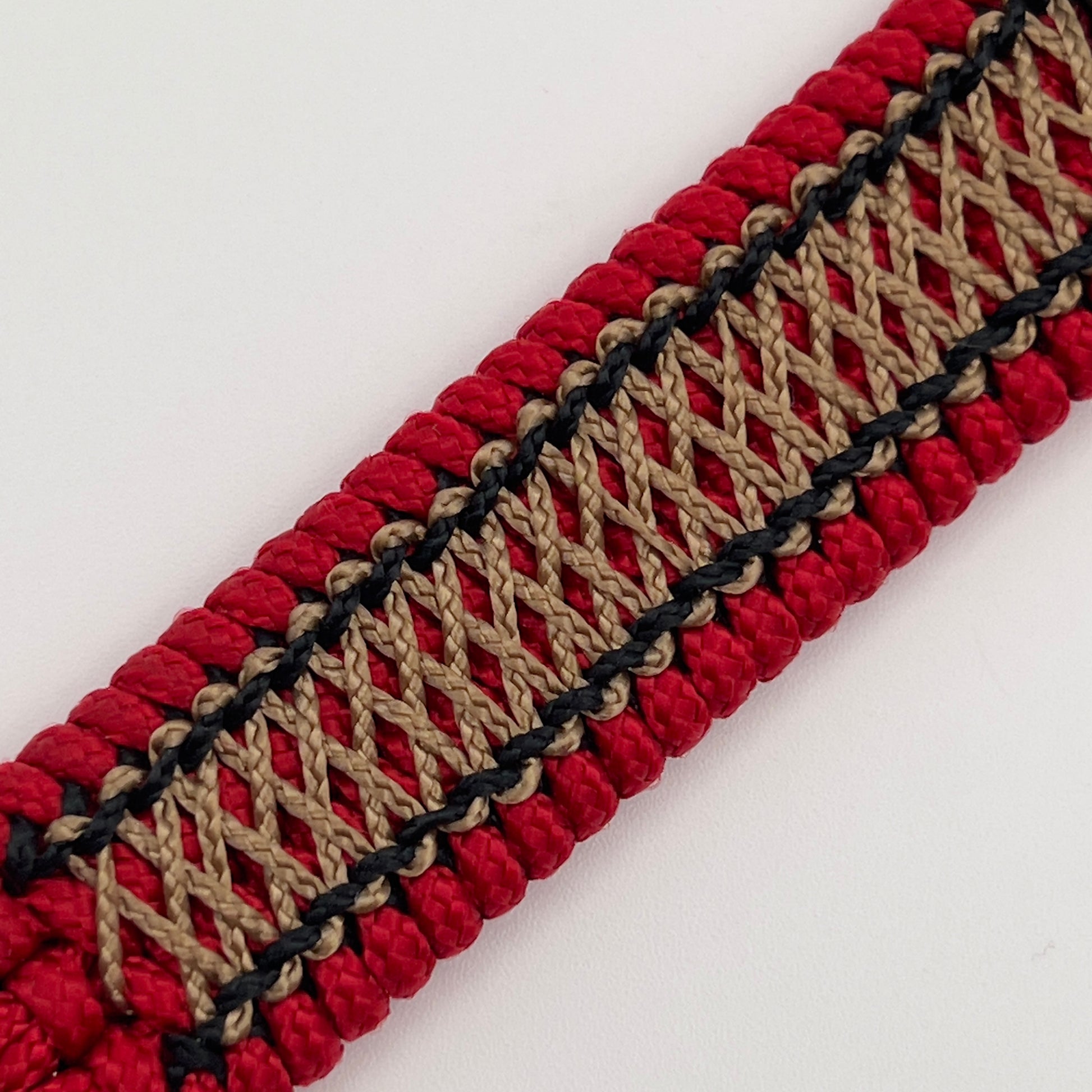 Thin, narrow, flexible and comfortable braided United States Marine Corps bracelet featuring the official US Marine Corps Eagle, Globe and Anchor medallion, a black Cobra style tactical buckle and woven with red Type-1 paracord and center stitched with black and gold nano cord.
