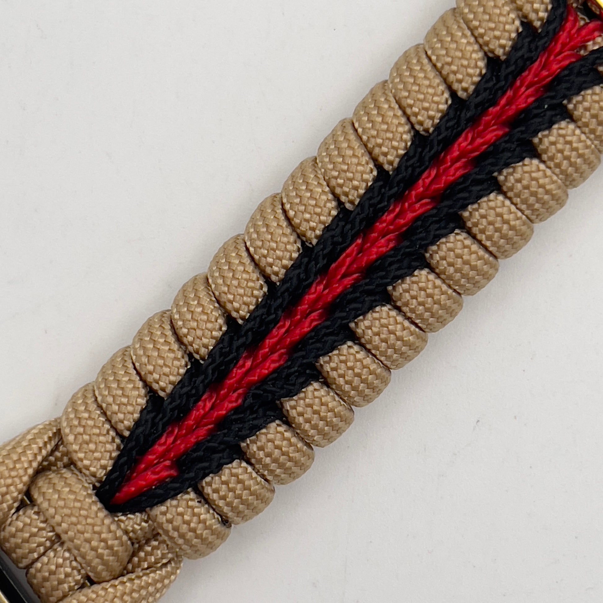 Thick and comfortable braided United States Marine Corps bracelet featuring a 24K gold and silver plated USMC officer Eagle Globe and Anchor medallion, a Cobra style tactical buckle and woven with gold 550 and Imperial red micro paracord.