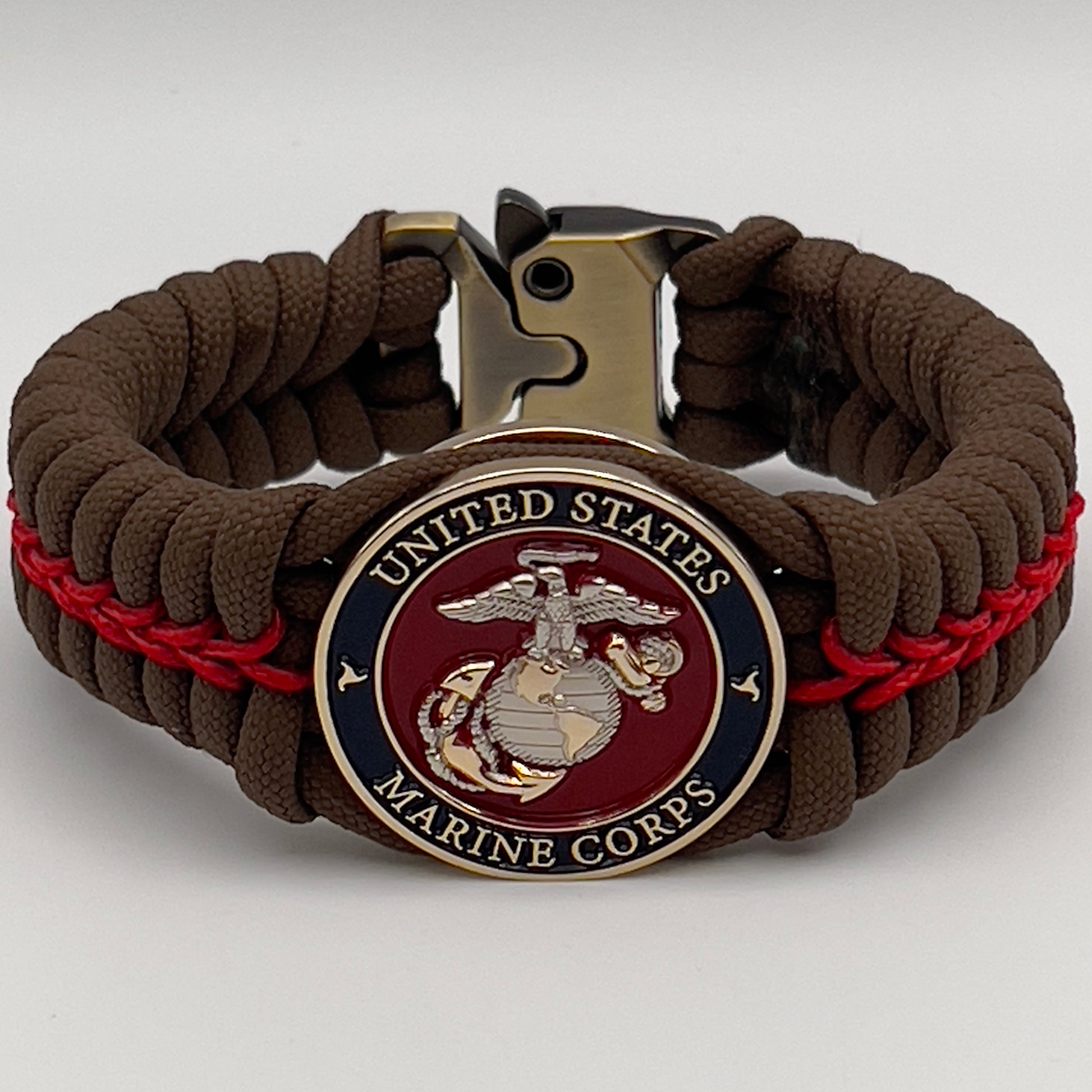 Thick, semi-rigid and comfortable braided United States Marine Corps bracelet featuring a 24K gold and silver plated USMC officer Eagle Globe and Anchor medallion, a Cobra style tactical buckle and woven with Coyote brown 550 and Imperial red micro paracord.