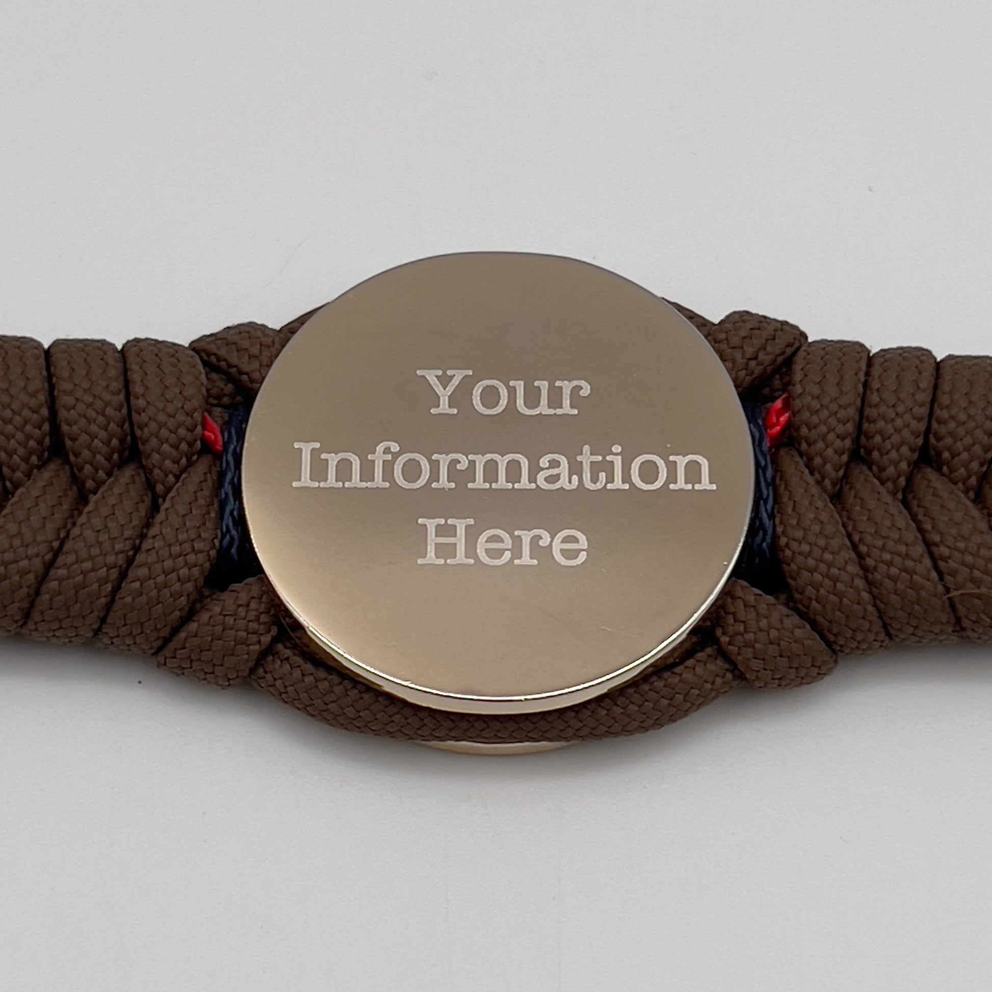 Thick, semi-rigid and comfortable braided United States Marine Corps bracelet featuring a 24K gold and silver plated USMC officer Eagle Globe and Anchor medallion, a Cobra style tactical buckle and woven with Coyote brown 550, Navy blue and Imperial red micro paracord.