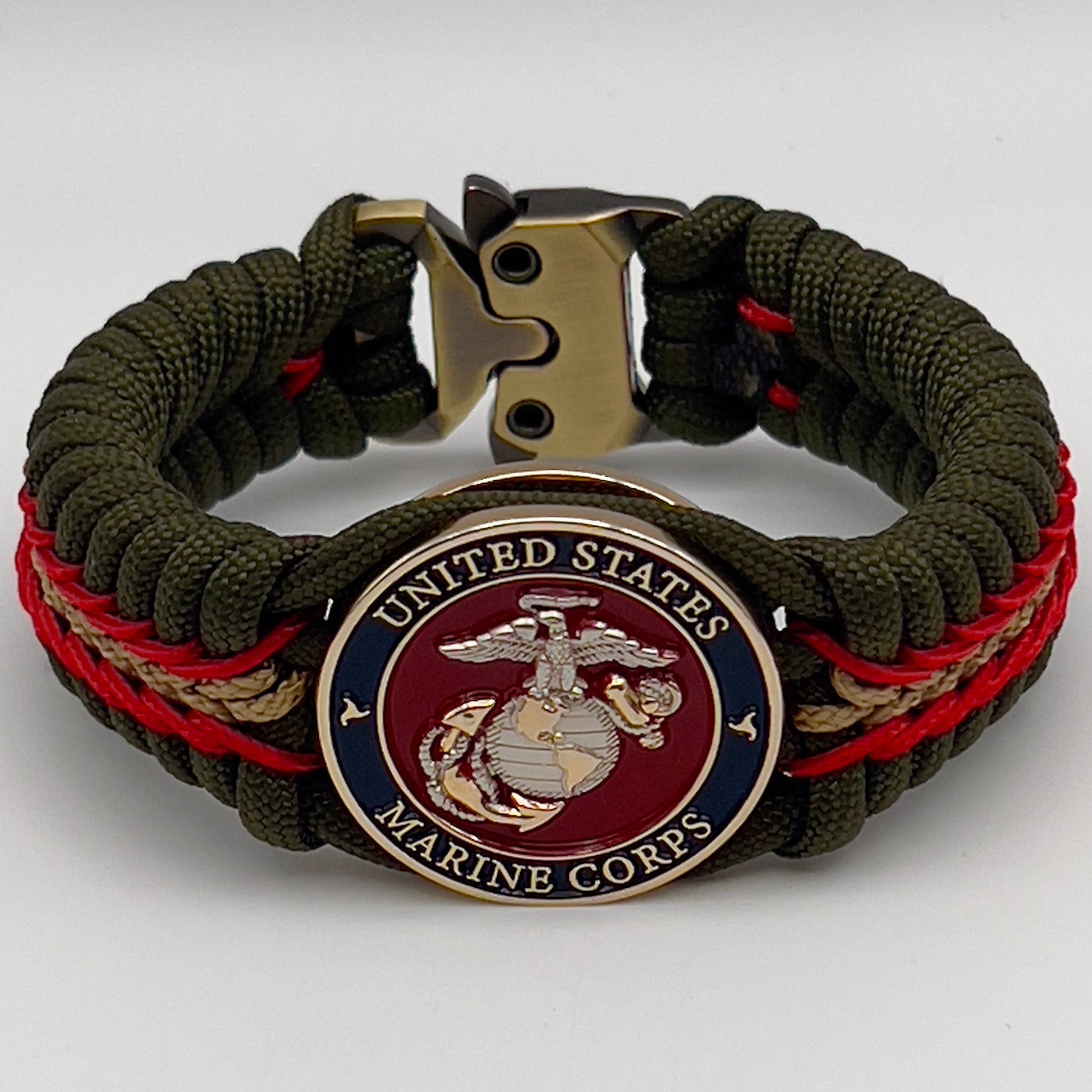 Thick, semi-rigid and comfortable braided United States Marine Corps bracelet featuring a 24K gold and silver plated USMC officer Eagle Globe and Anchor medallion, a gold Cobra style tactical buckle and woven with olive drab 550 and gold micro paracord.