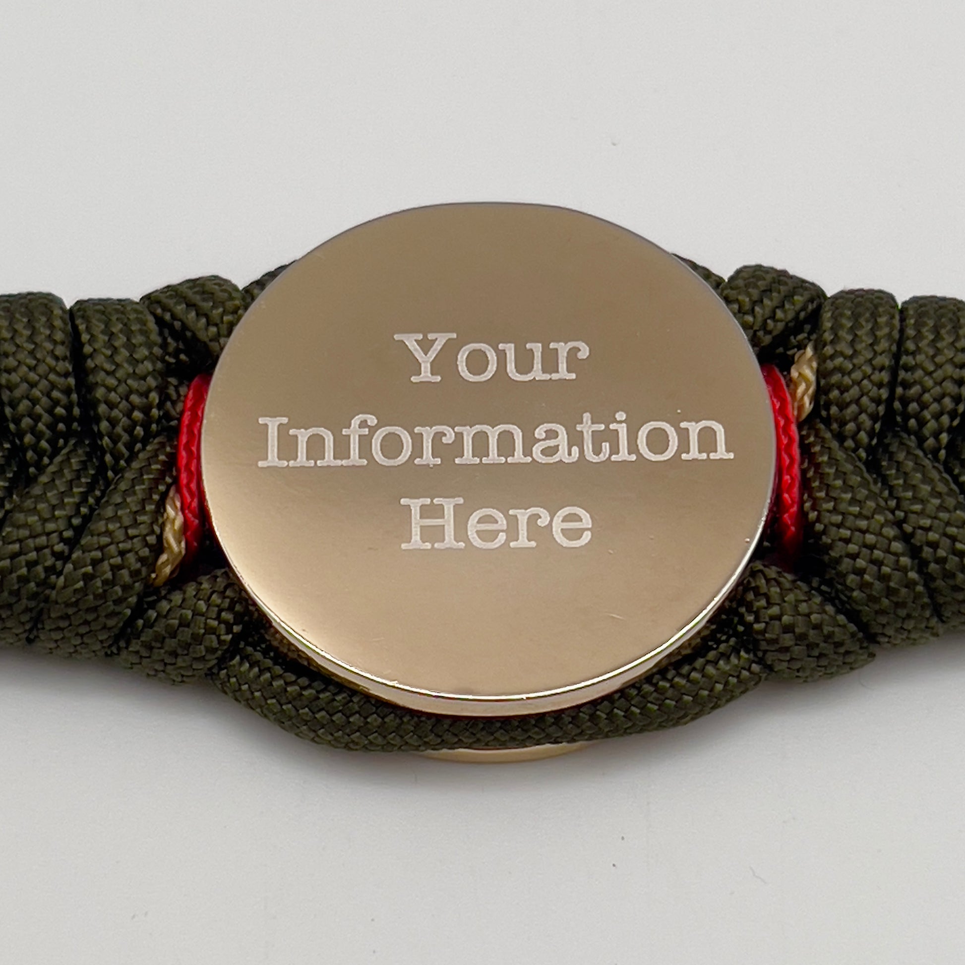Thick, semi-rigid and comfortable braided United States Marine Corps bracelet featuring a 24K gold and silver plated USMC officer Eagle Globe and Anchor medallion, a gold Cobra style tactical buckle and woven with olive drab 550 and gold micro paracord.