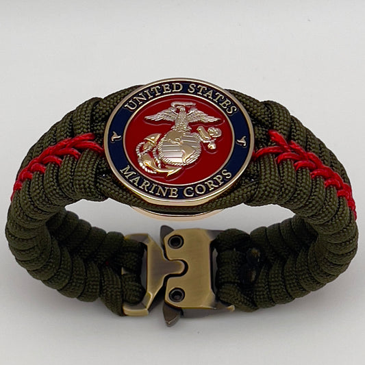 Thick, semi-rigid and comfortable braided United States Marine Corps bracelet featuring a 24K gold and silver plated USMC officer Eagle Globe and Anchor medallion, a gold Cobra style tactical buckle and woven with olive drab 550 and Imperial red micro paracord.